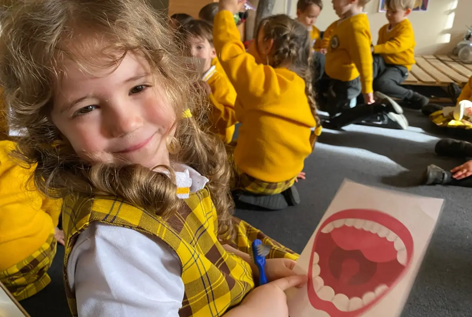 York primary school student learning the importance of brushing teeth.