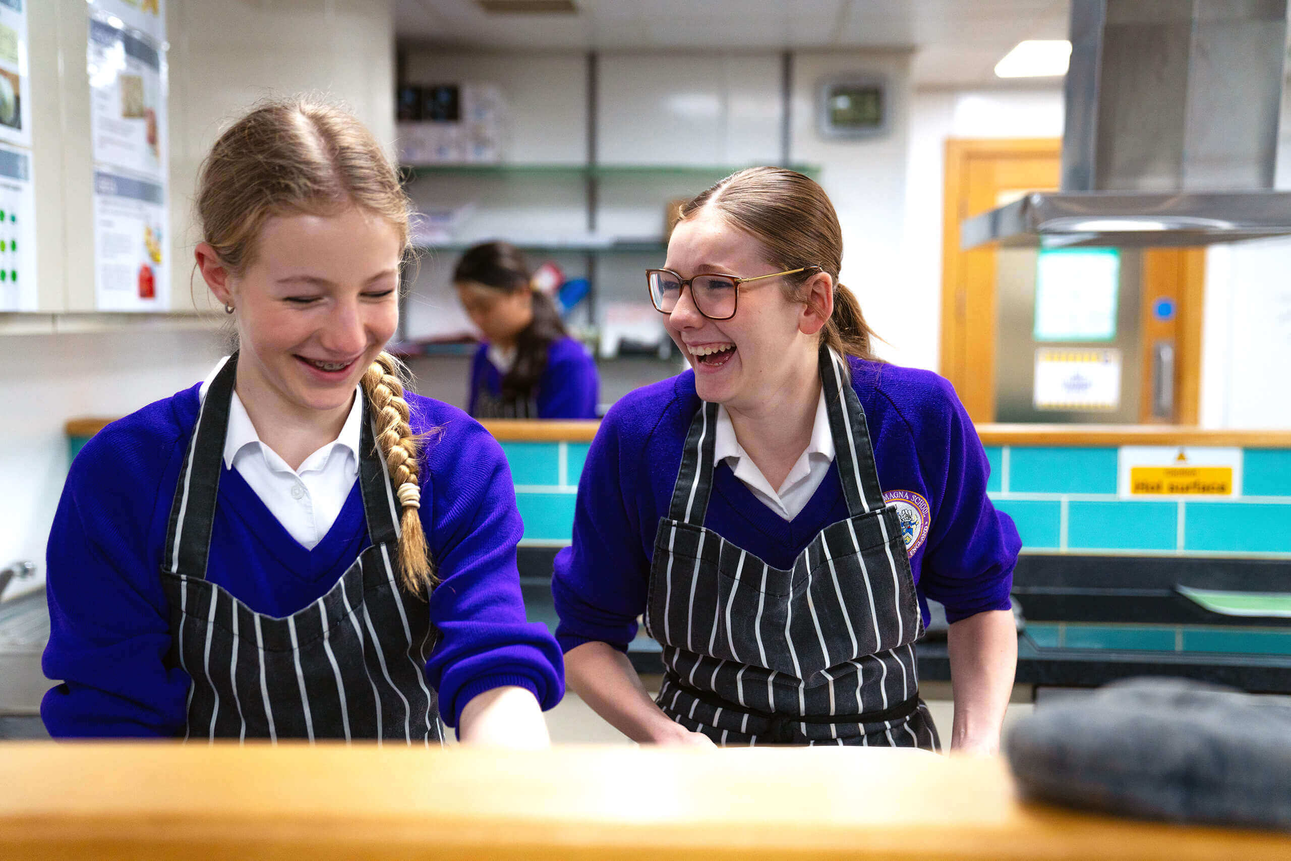 Two middle school students enjoying a food tech lesson.
