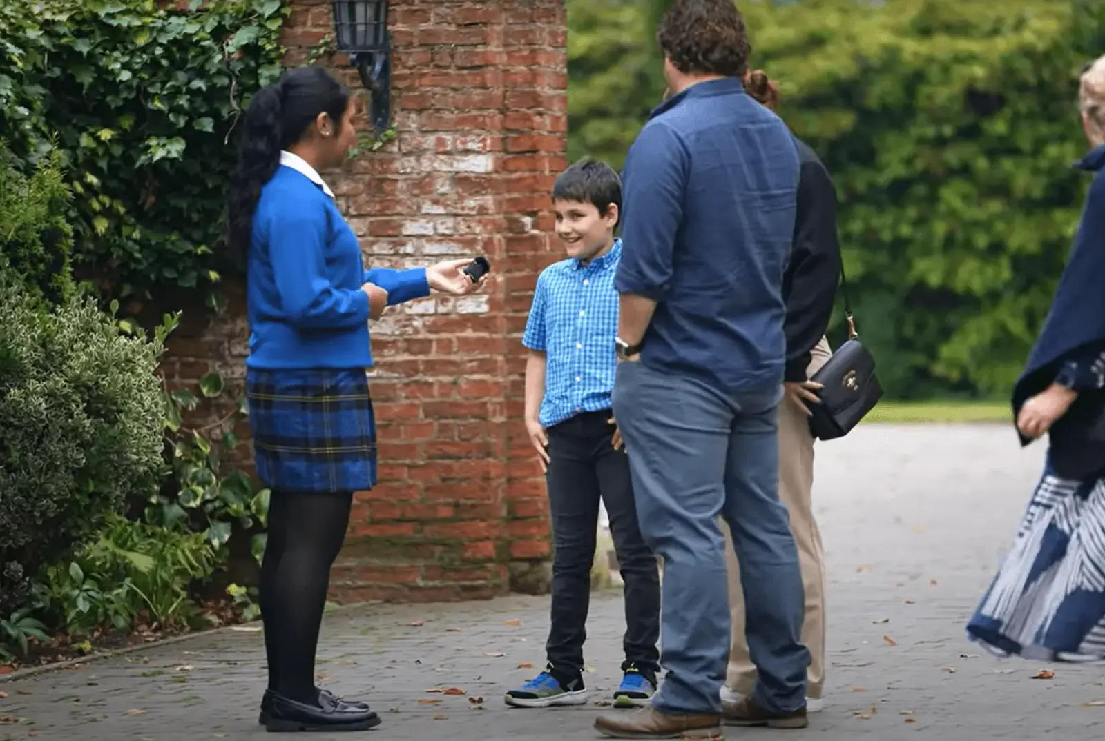 A Key Stage 4 student interviewing a family.