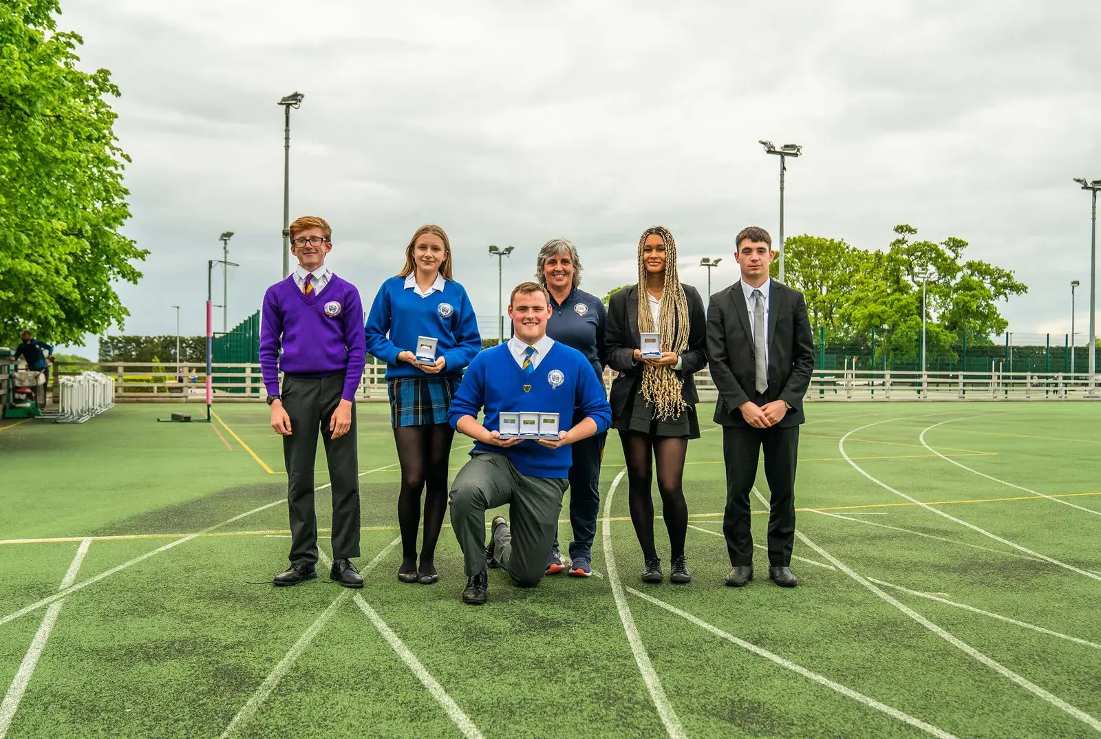 Students at Queen Ethelburga's celebrating their athletics awards