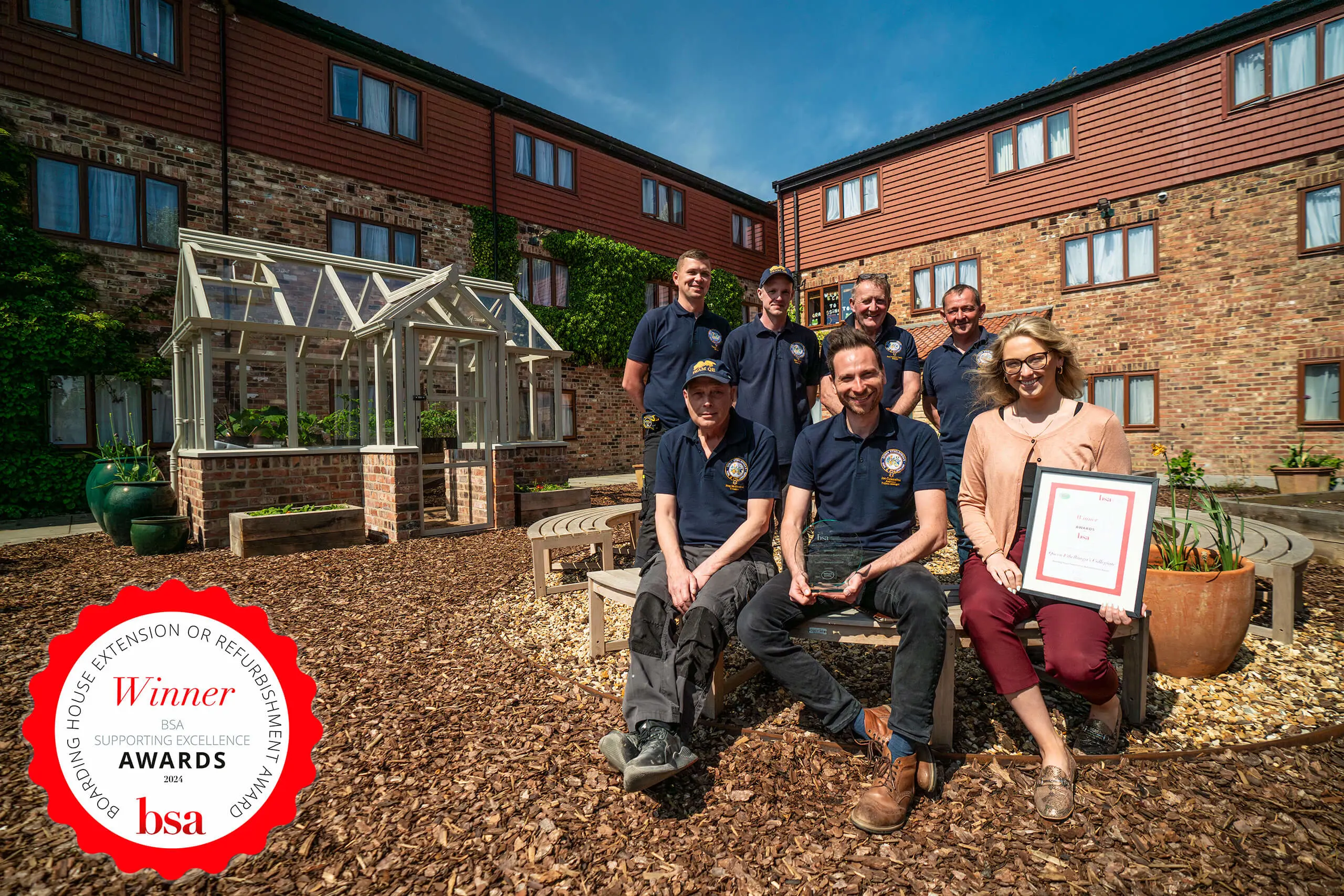 The Estates Team holding the BSA Boarding House Extension or Refurbishment Award.