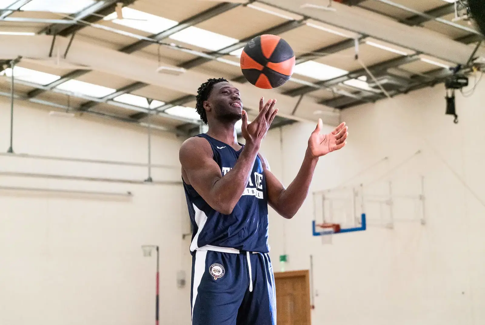 QE Pupil playing basketball