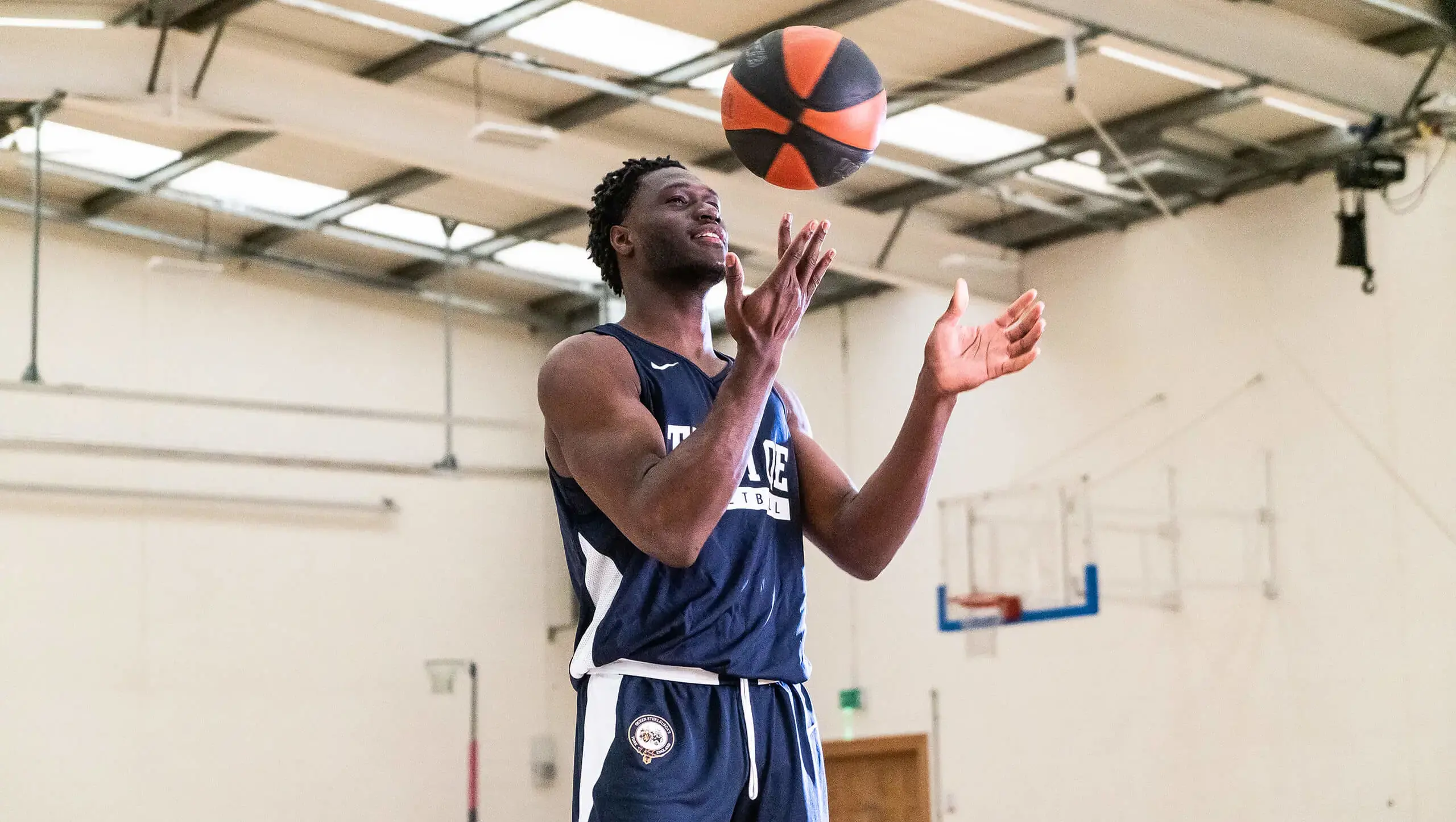 QE student playing basketball