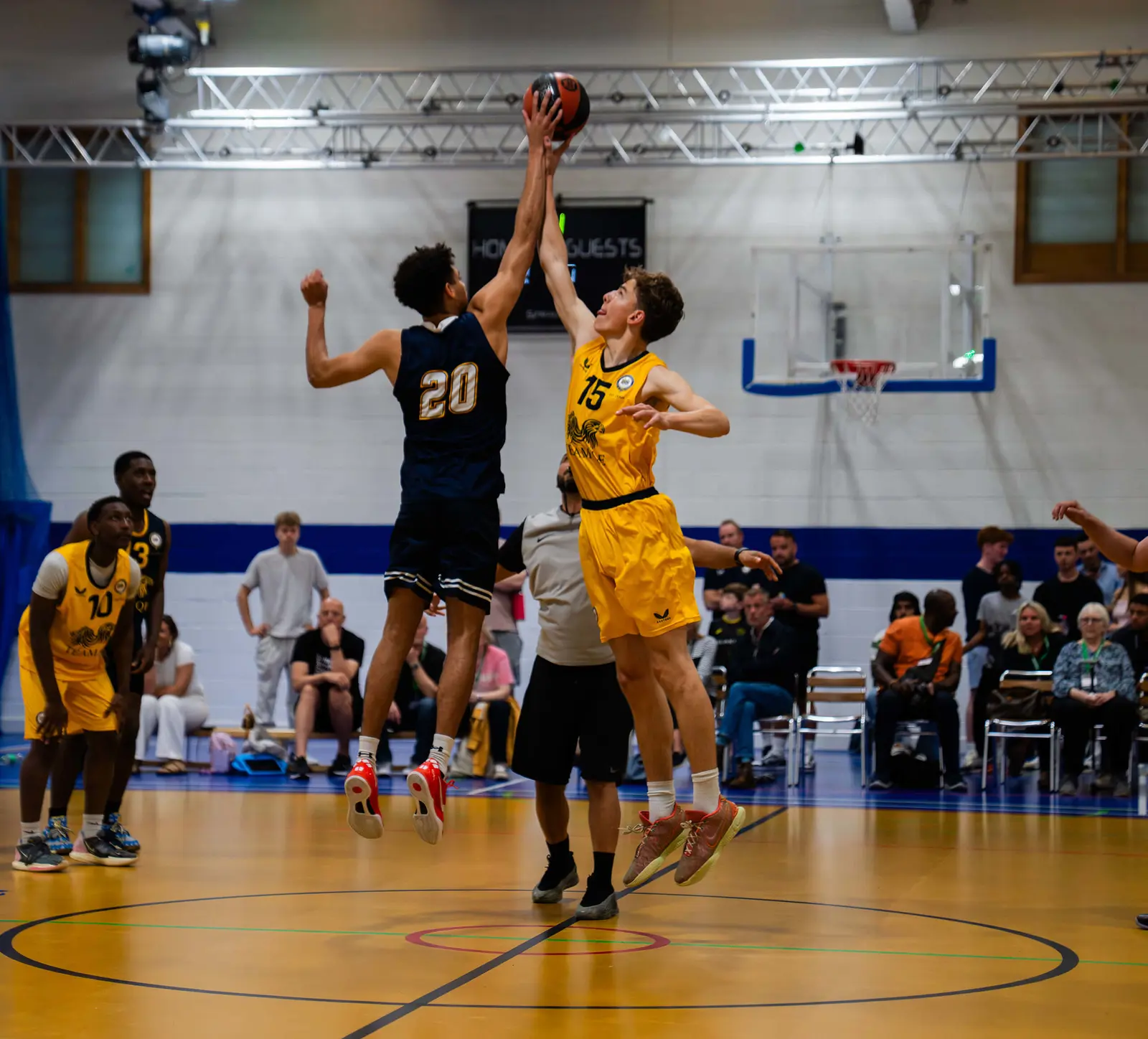 Student playing basketball at top sport school.