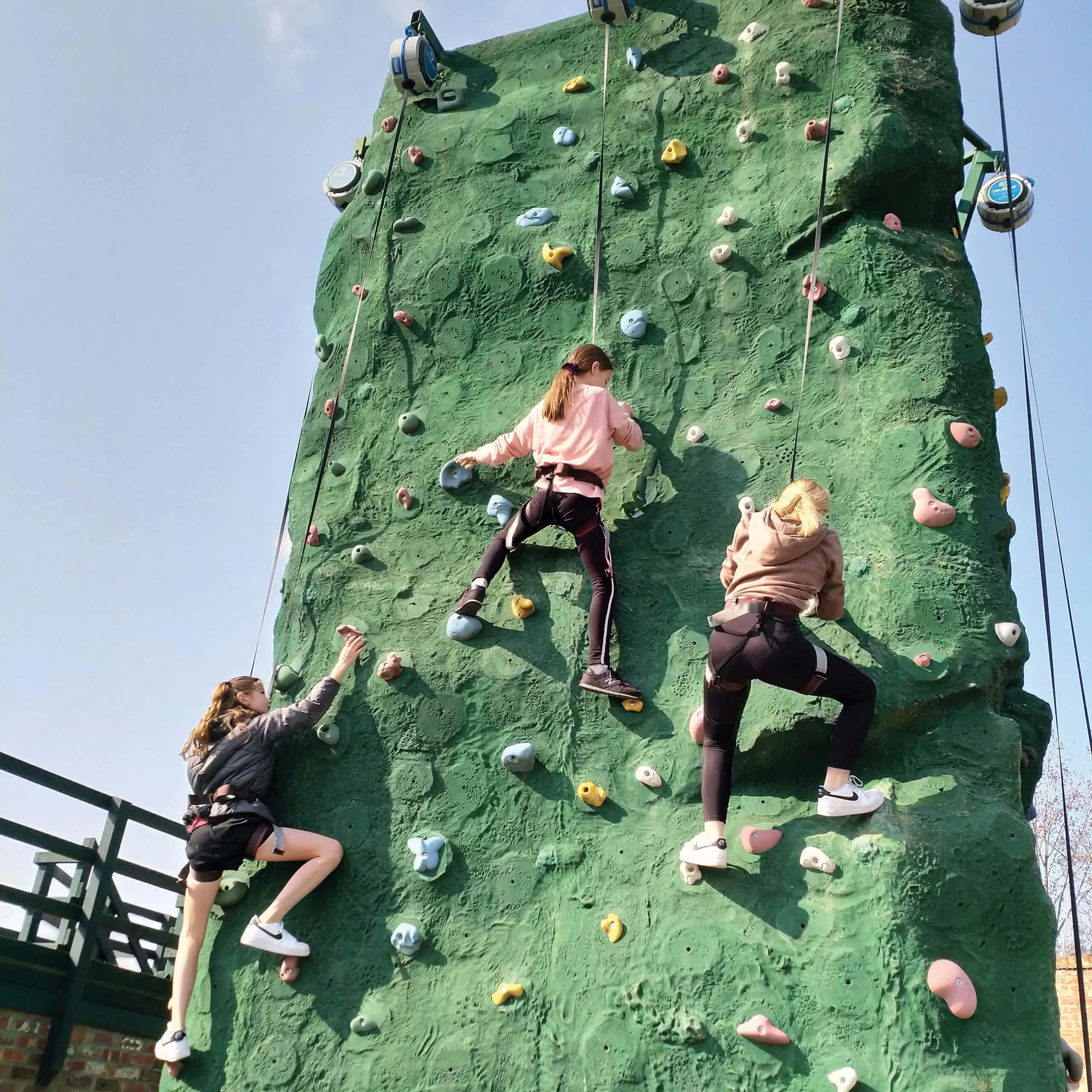 Children on a climbing wall at Queen Ethelburga's