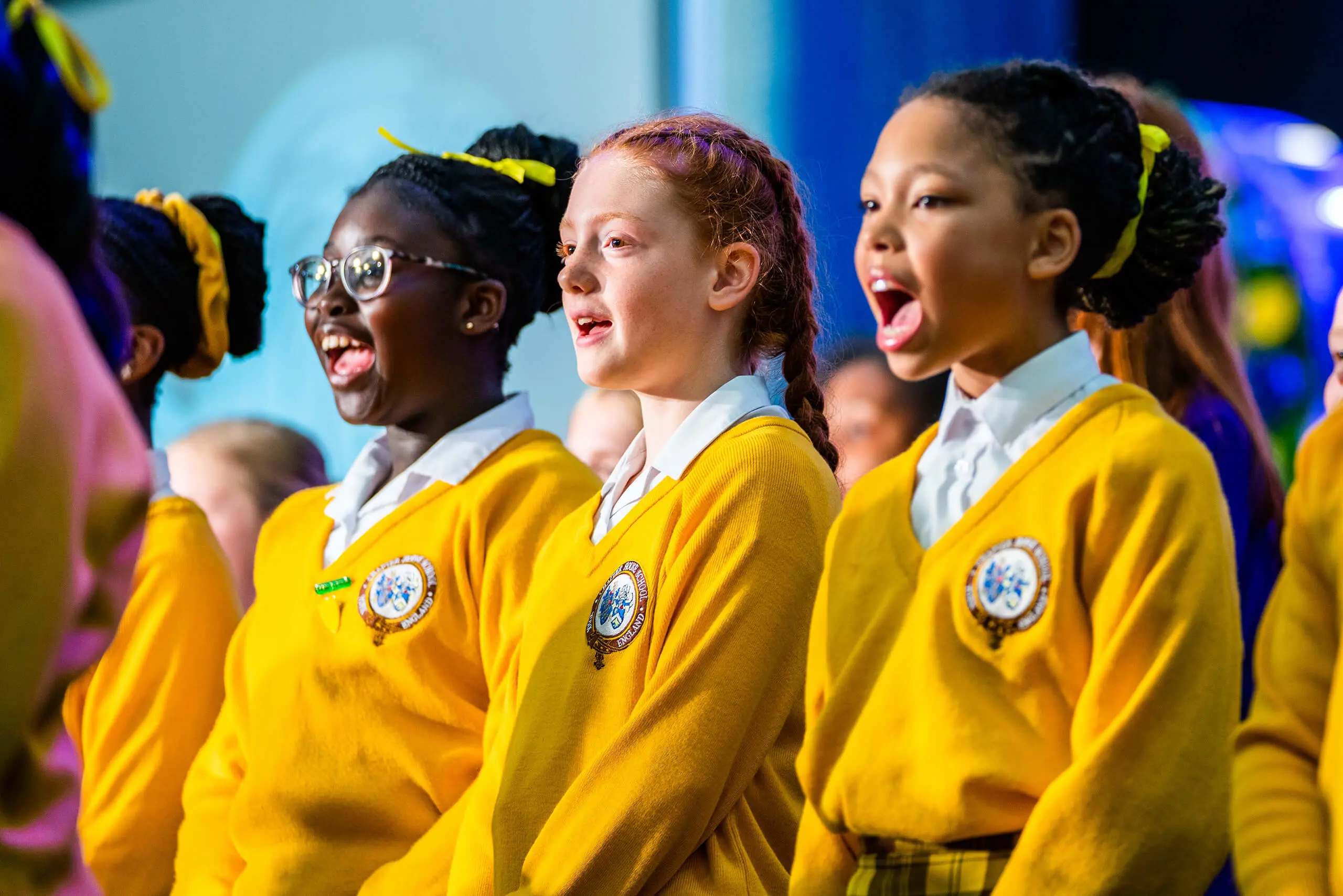 Group of girls singing at Chapter House's Speech Day