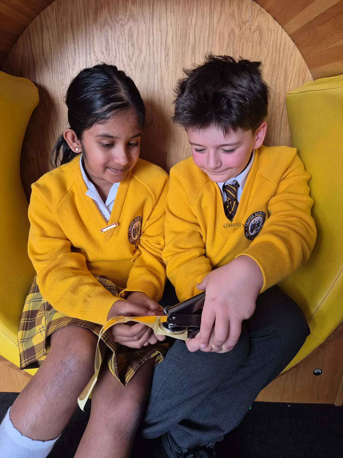 Students working as a library assistant at York Primary School