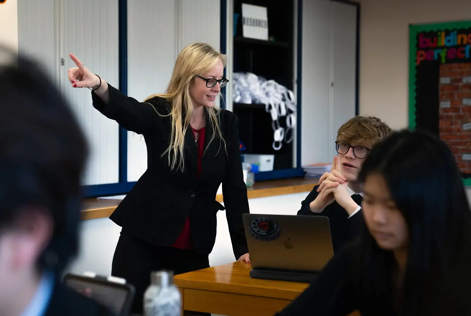 Teacher speaking to a student.