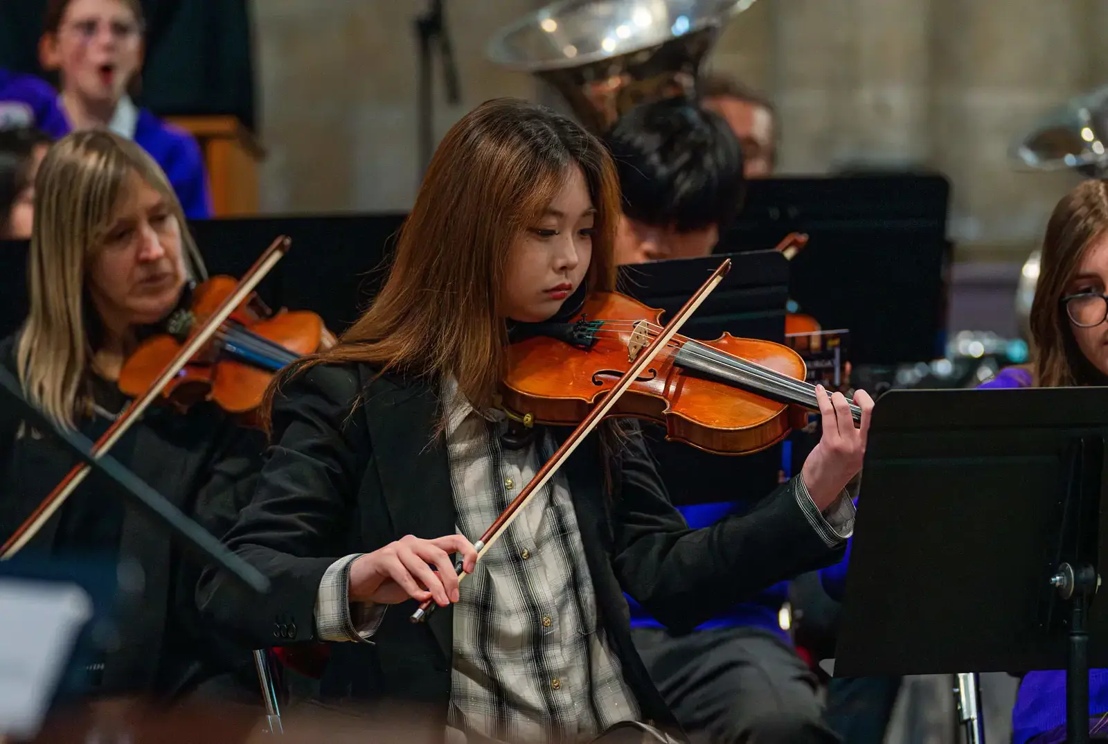 Student playing the violin at Queen Ethelburga's.