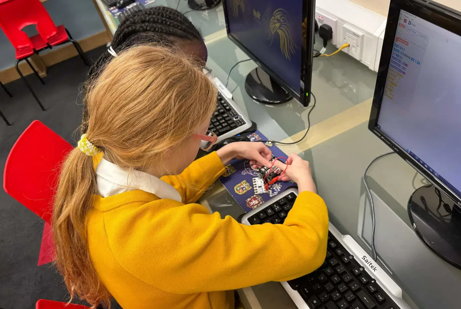 Students using computers for Science experiments.