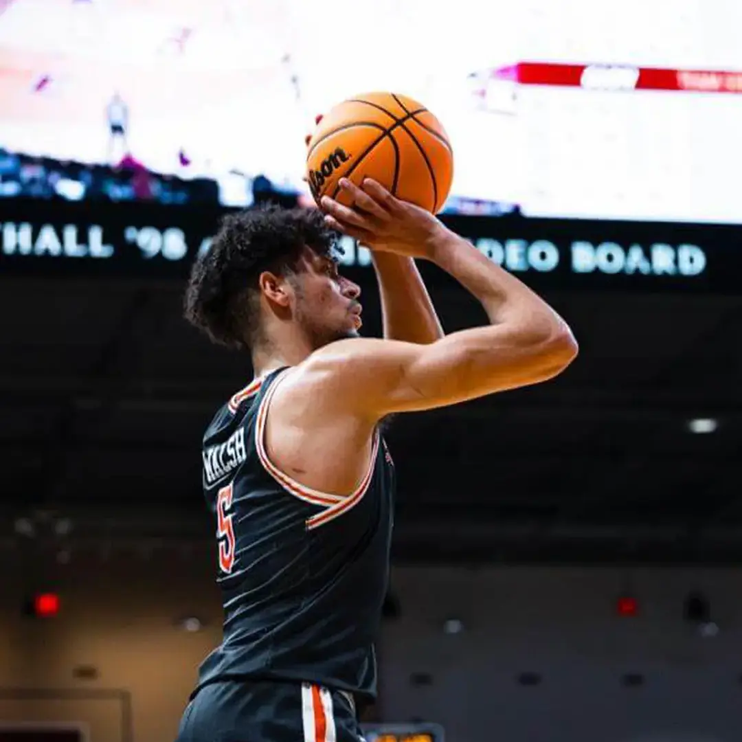 Elijah competing in a professional basketball game after attending a York boarding school.