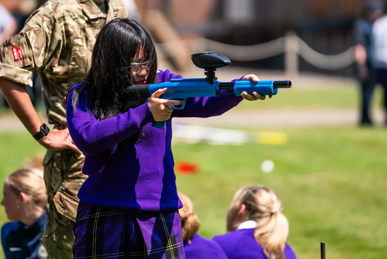 King's Magna pupil enjoying paint-balling shooting practice