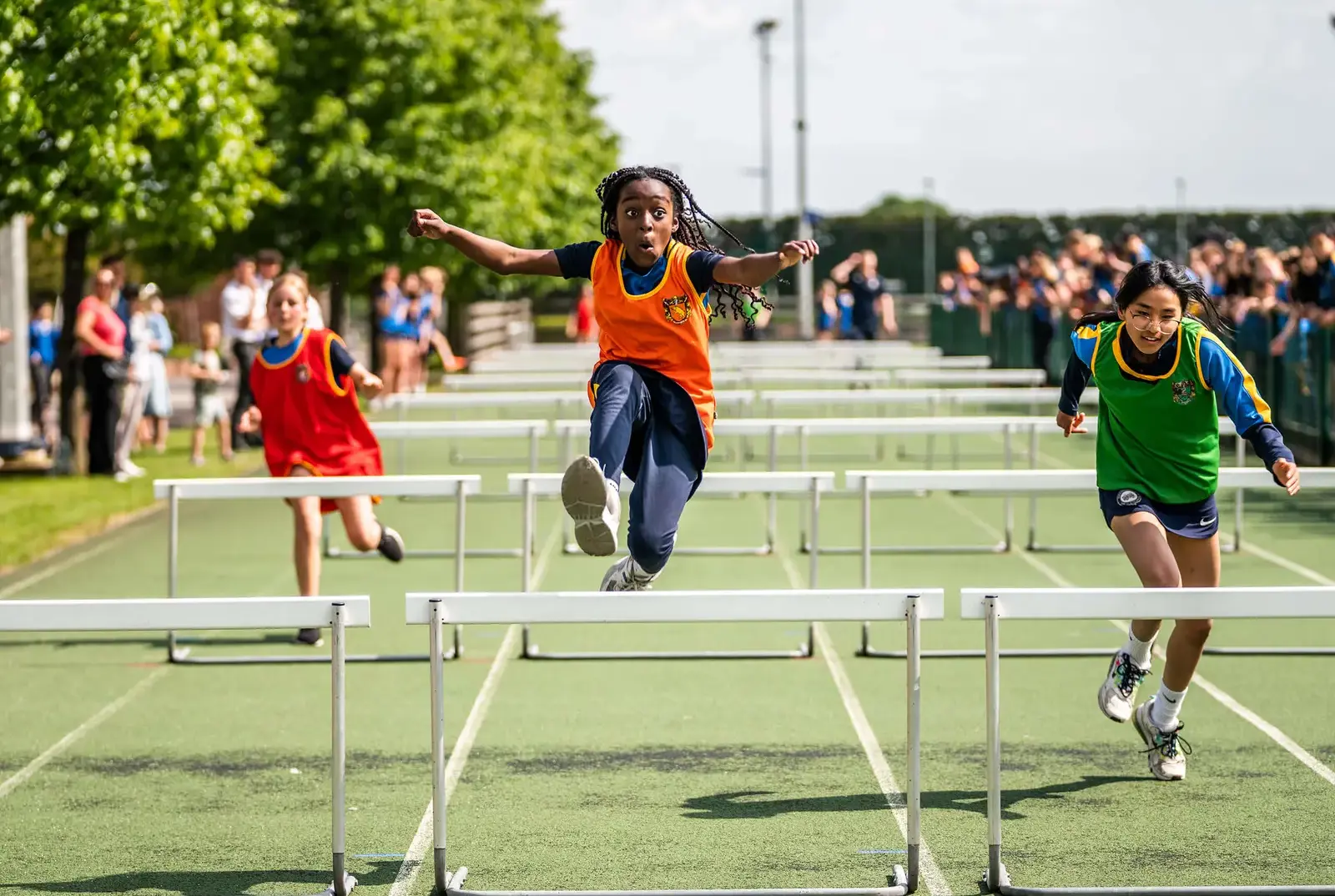 QE students competing in hurdles