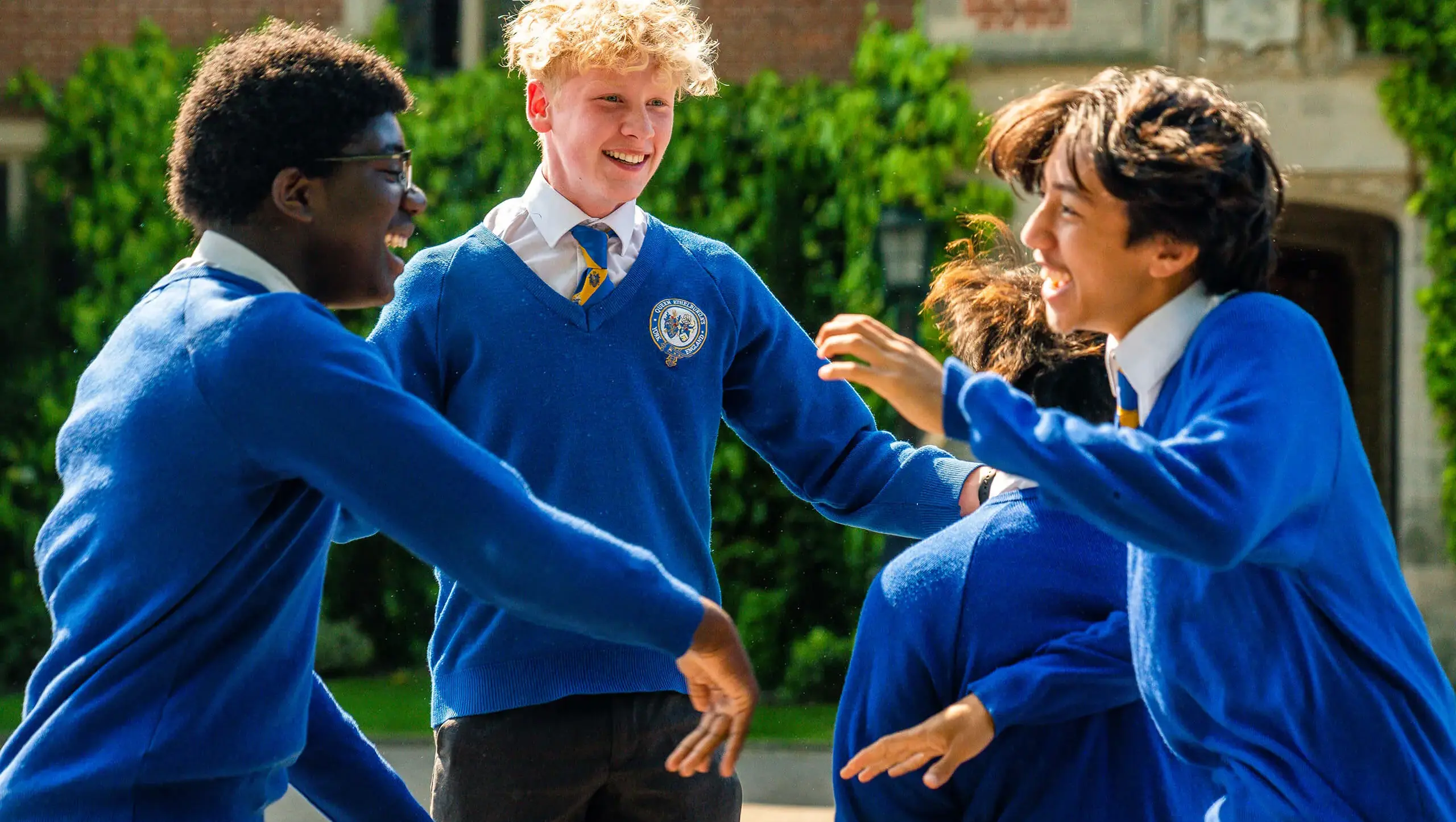 Students celebrating their results at QE College.