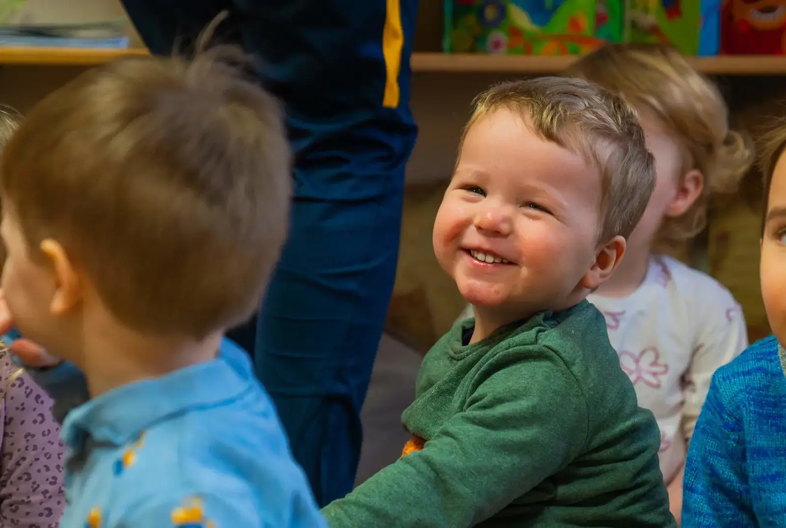 Boy smiling in Explorers Nursery.