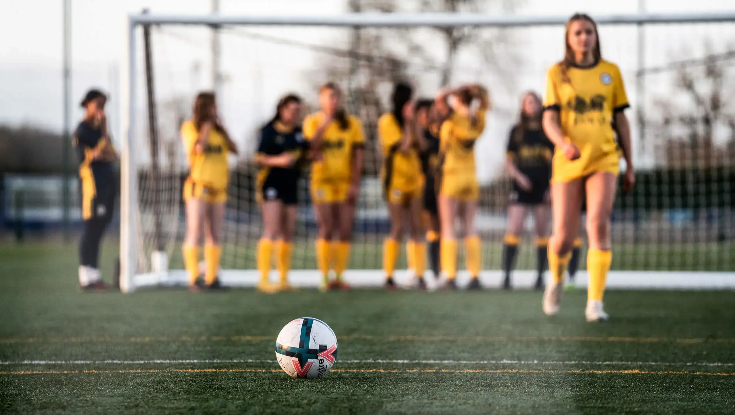 Blurred photo of girls in goal playing football at York Independent School