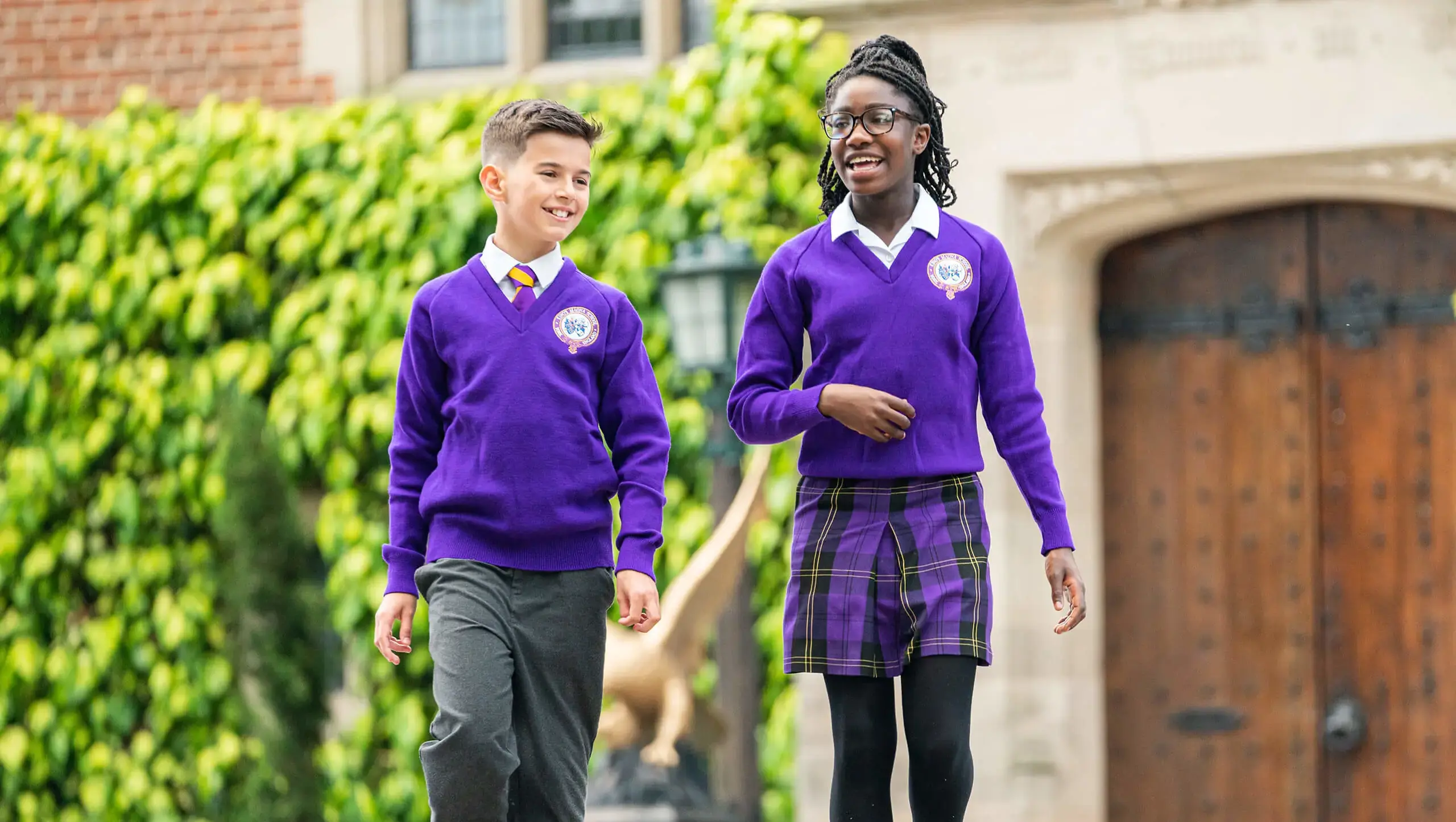 Queen Ethelburga's pupils walking in the school grounds