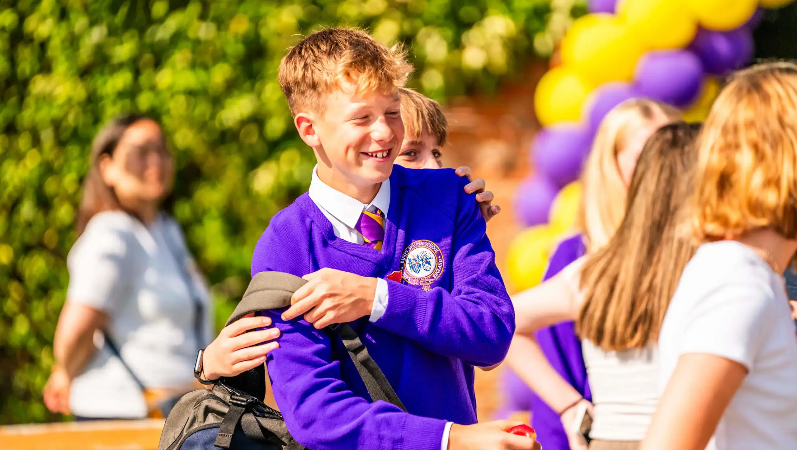 Students in the playground at Queen Ethelburga's Collegiate