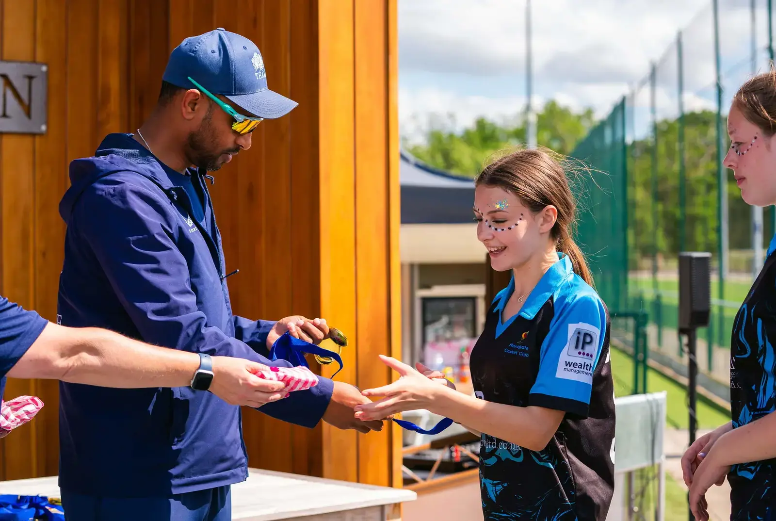 Students collecting medals at the Mini Cricket Festival.