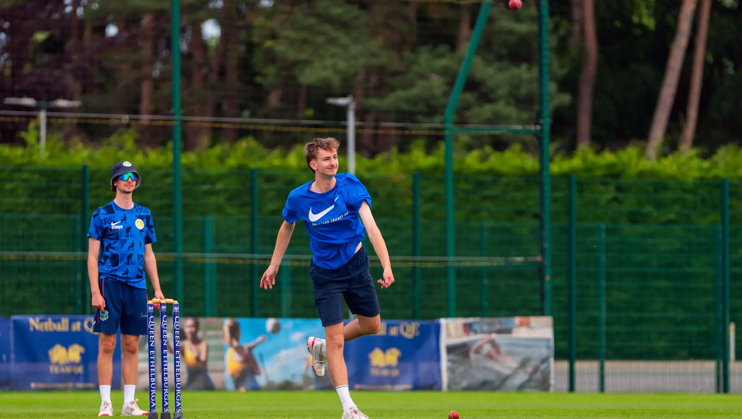 Cricketer bowling at Queen Ethelburga's Cricket Camp.
