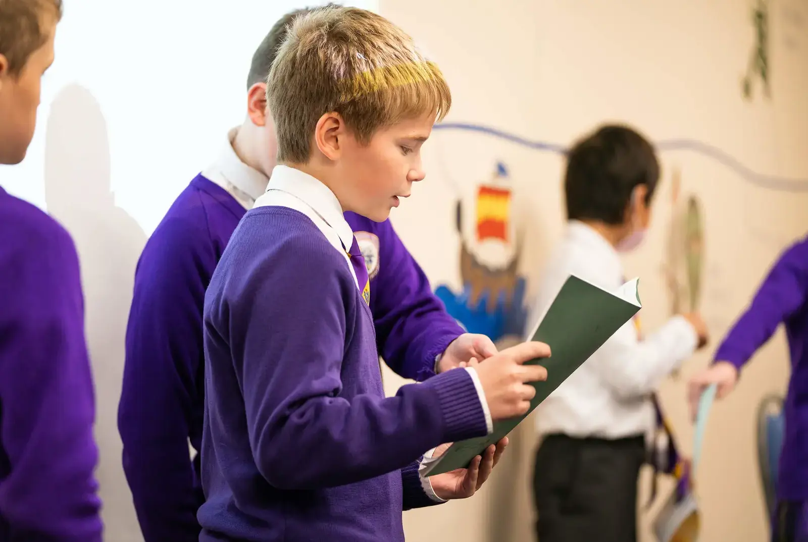 King's Magna pupil reading a book at Queen Ethelburga's Collegiate