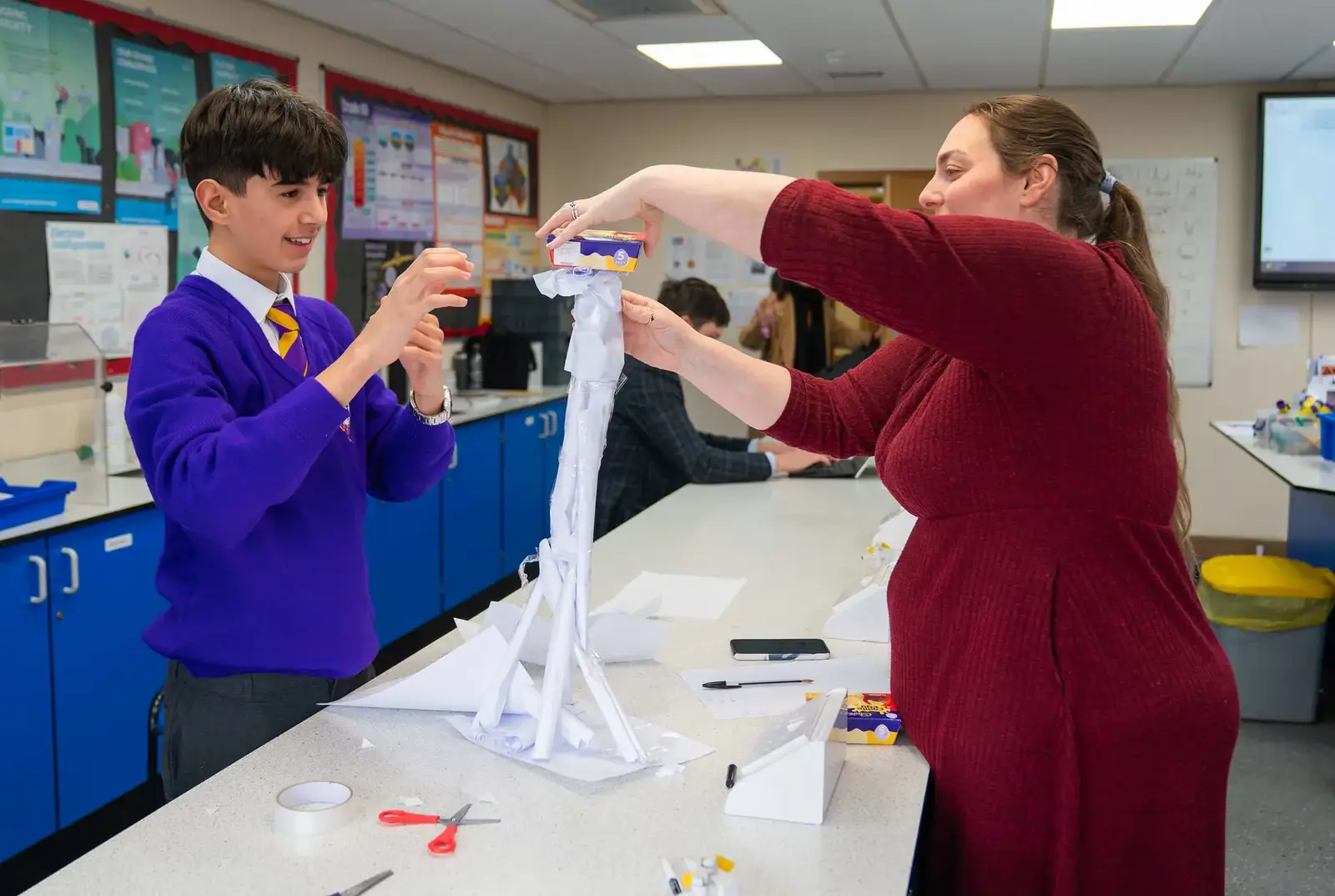 A student making a tower.