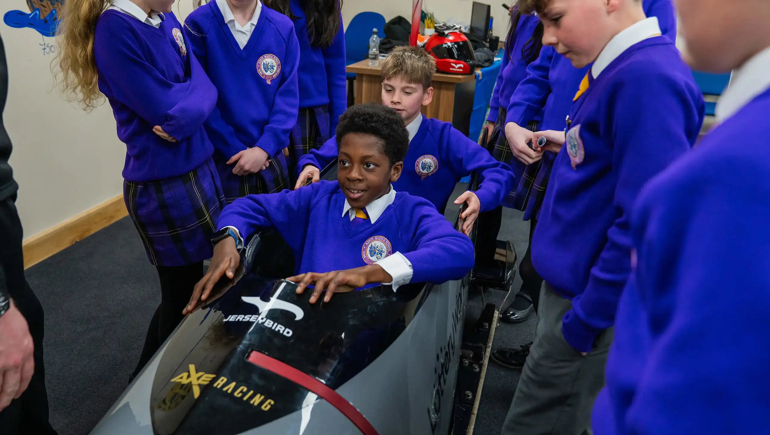 Students in a bob sleigh.