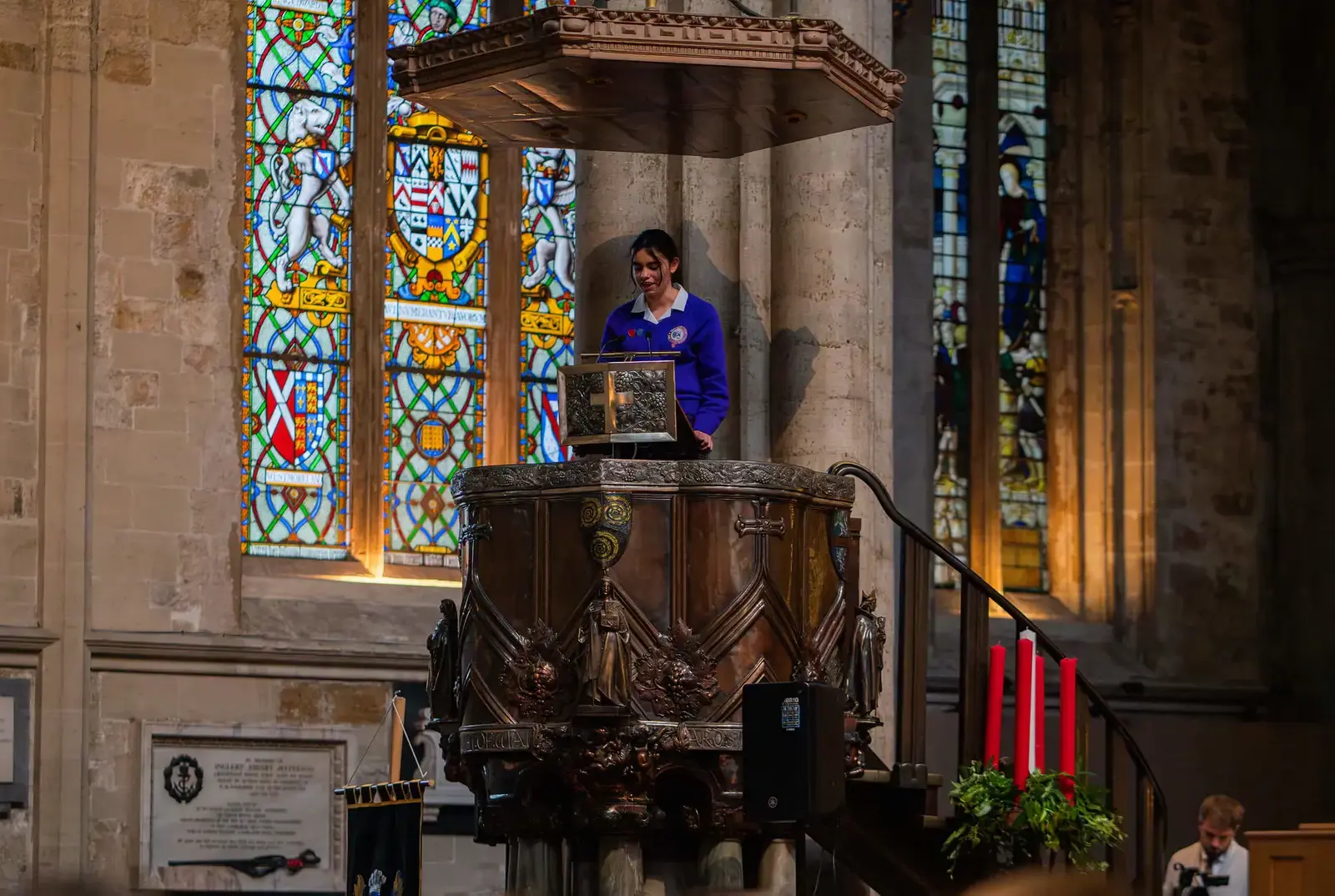 Student speaking at the Carol Service.