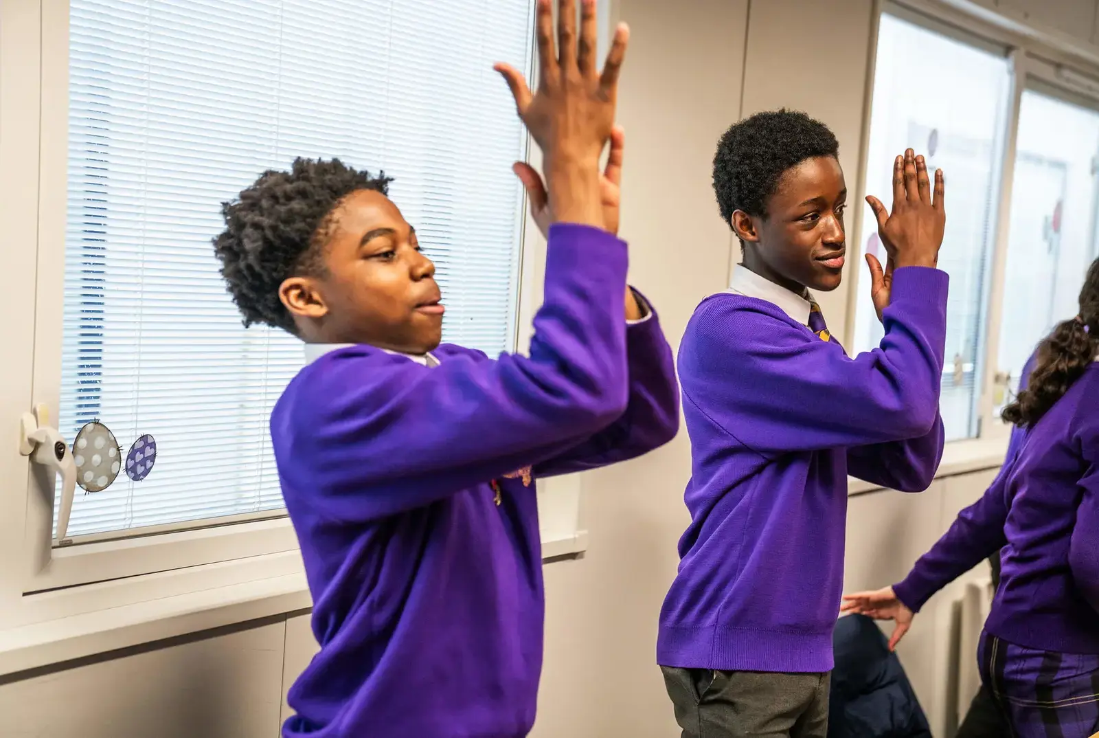 Students clapping a music lesson.