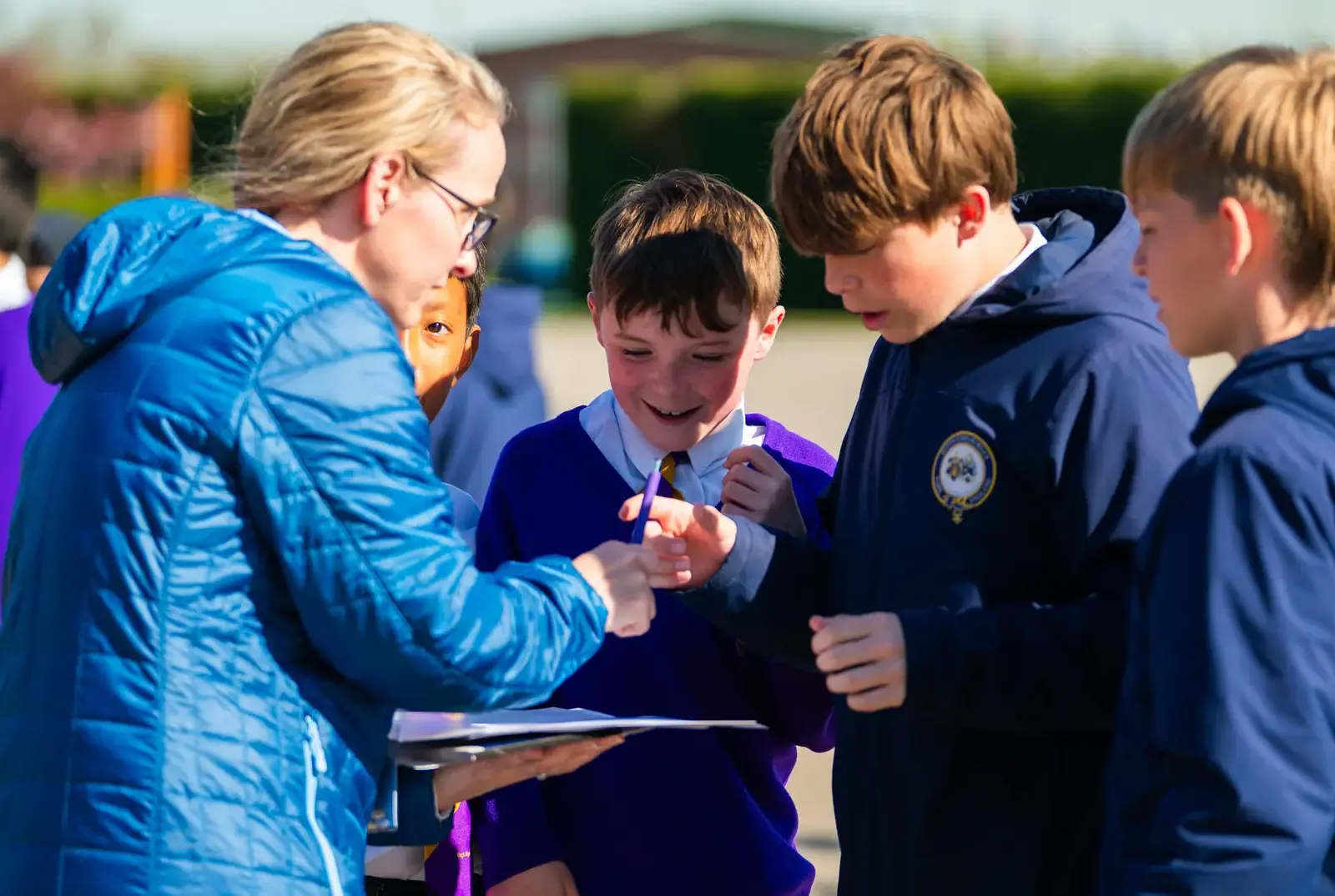 Students speaking to a parent at the Easter event.