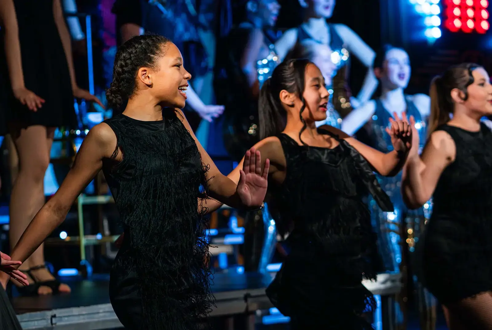 Students dancing in Bugsy Malone as part of performing arts.