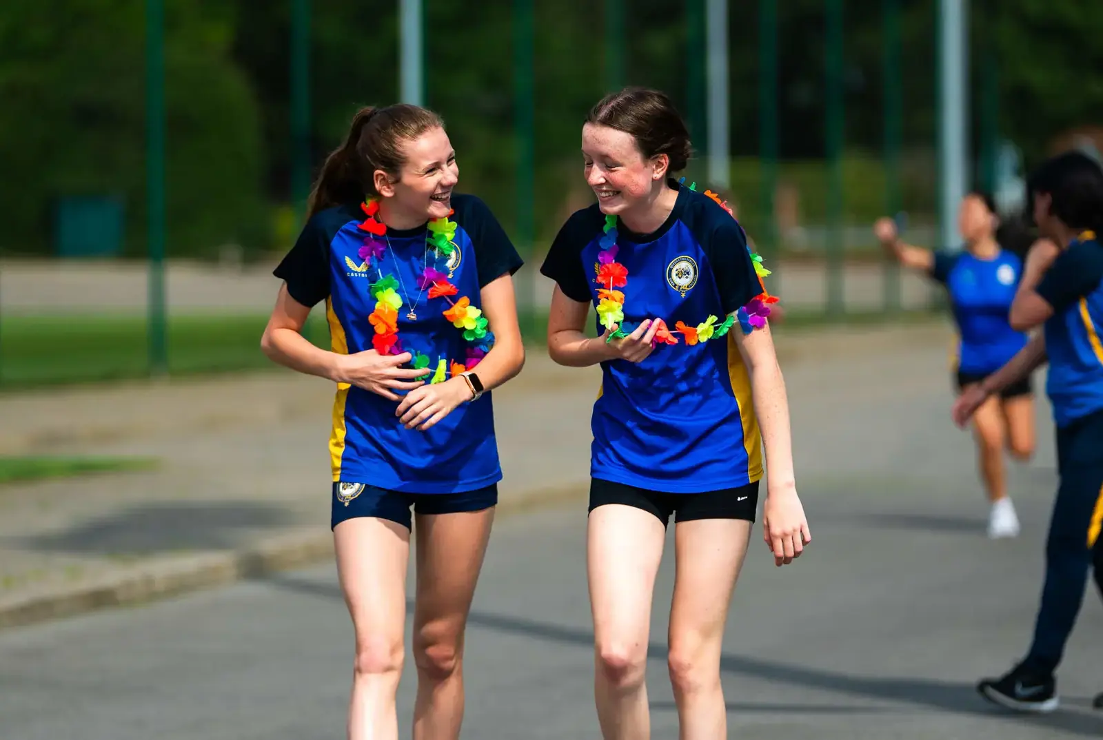 Two students laughing together.