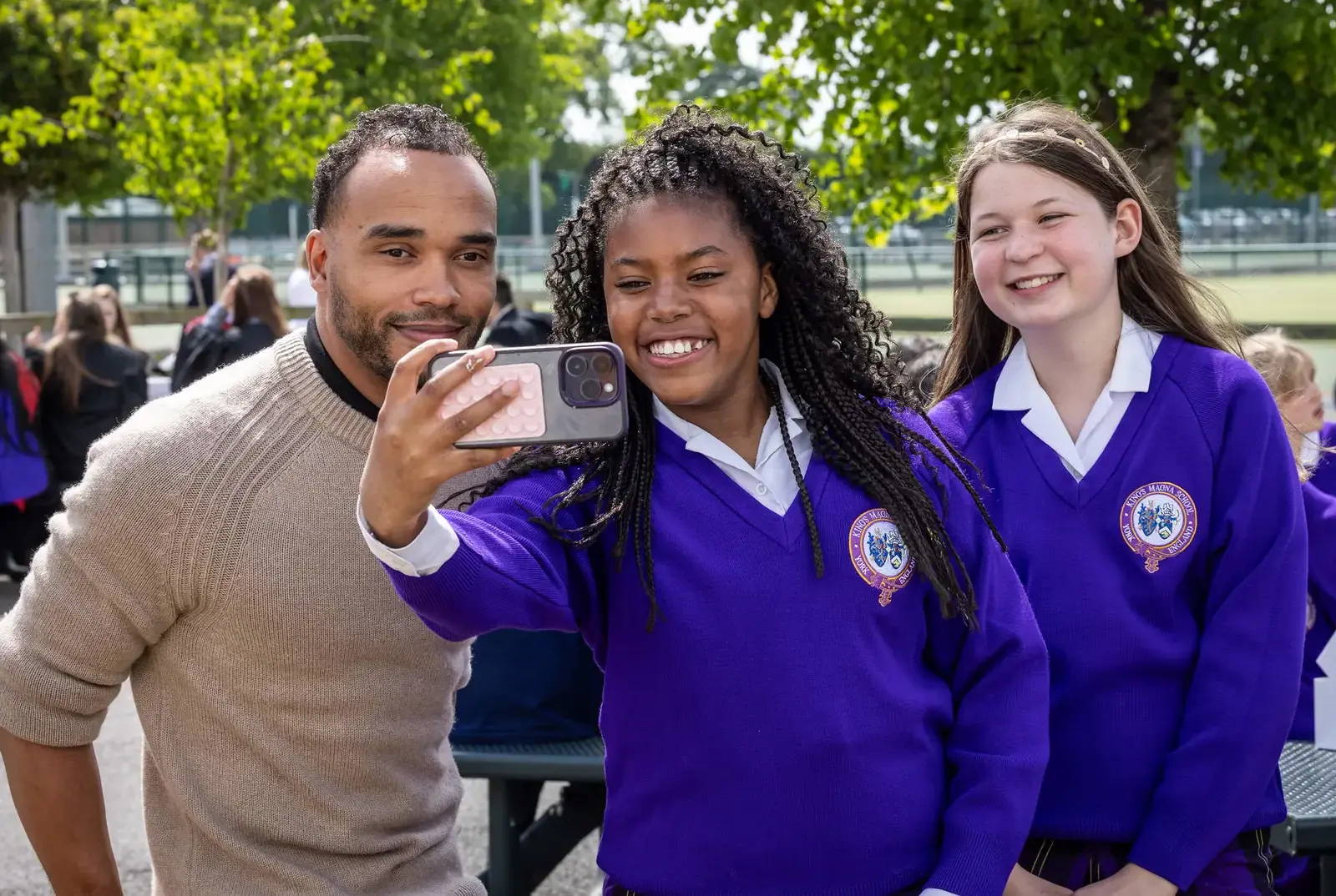 Students taking a photo with Nicholas Hamilton