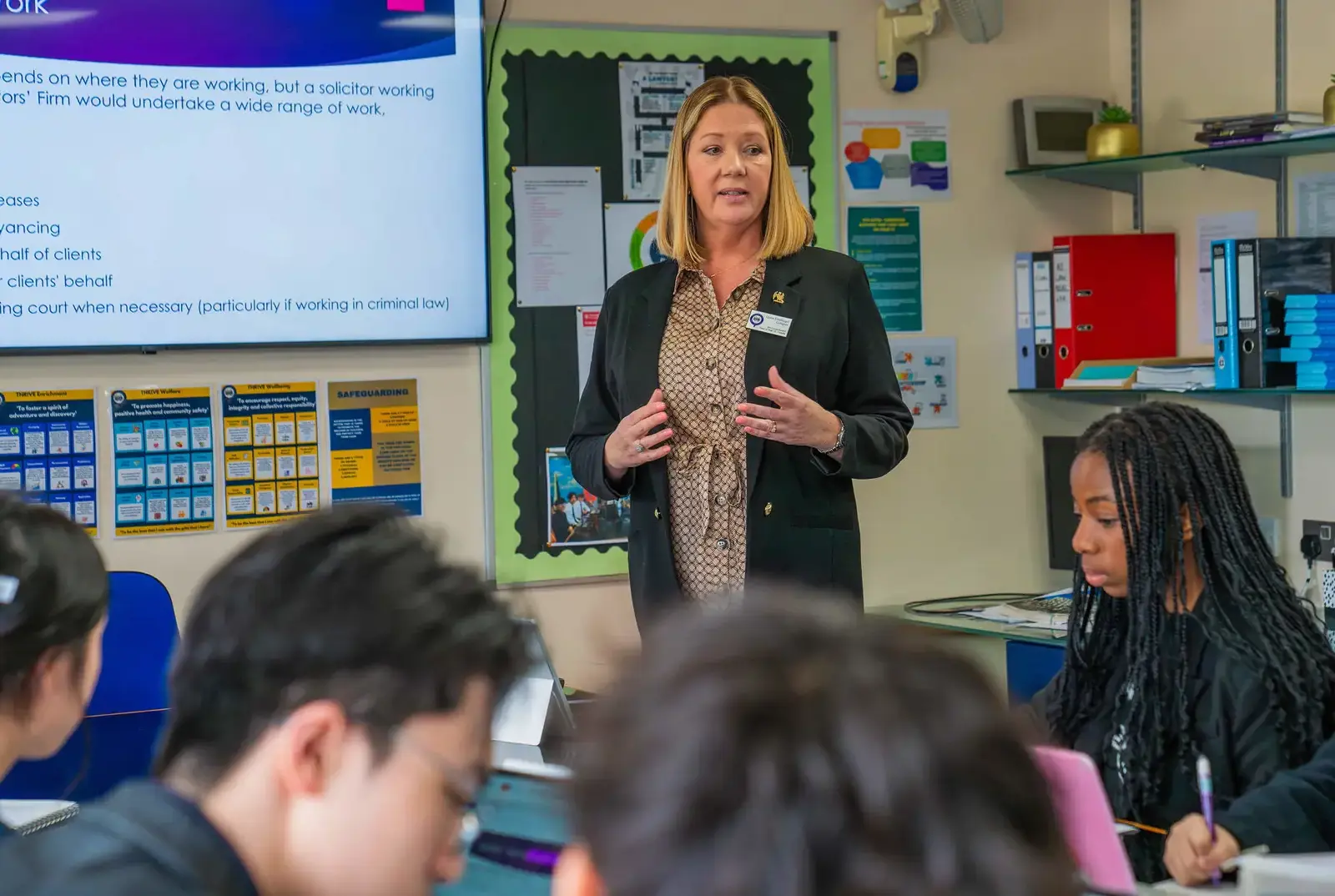 A Faculty and College teacher at Queen Ethelburga's Collegiate.