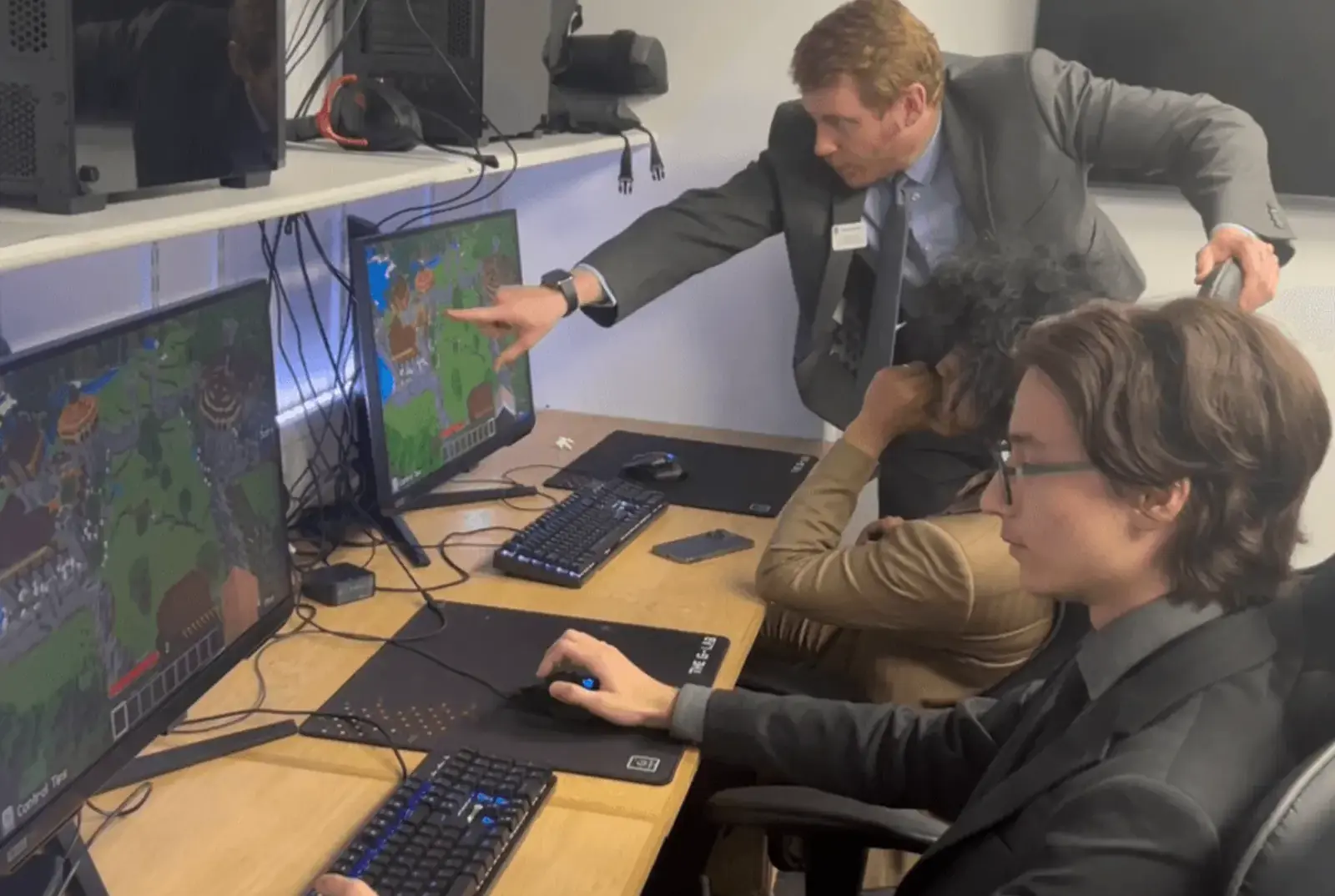 Mr Luxford helping the team win the Minecraft Esports final.