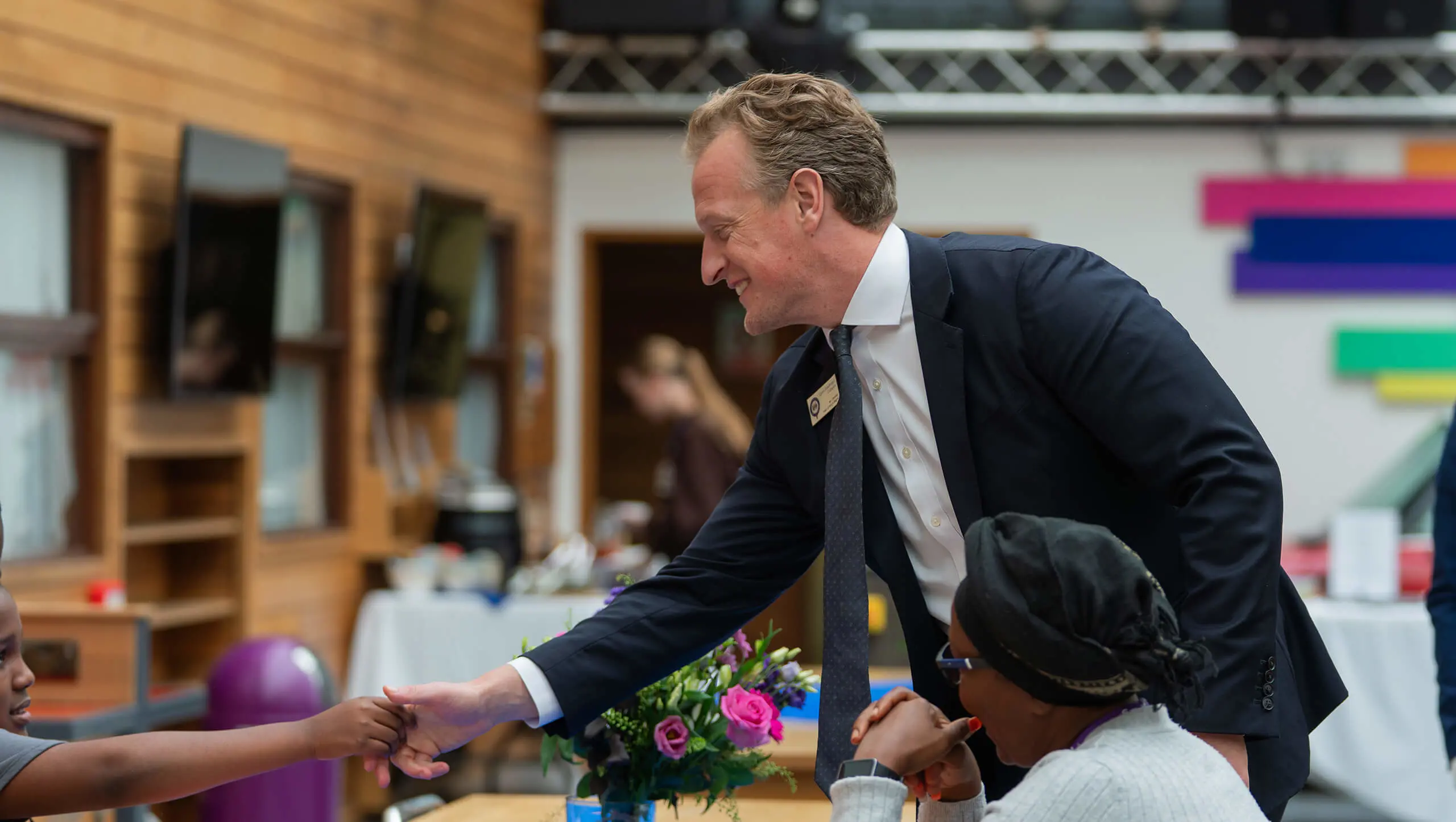 Mr Birchall shaking hands with a student at Open Day