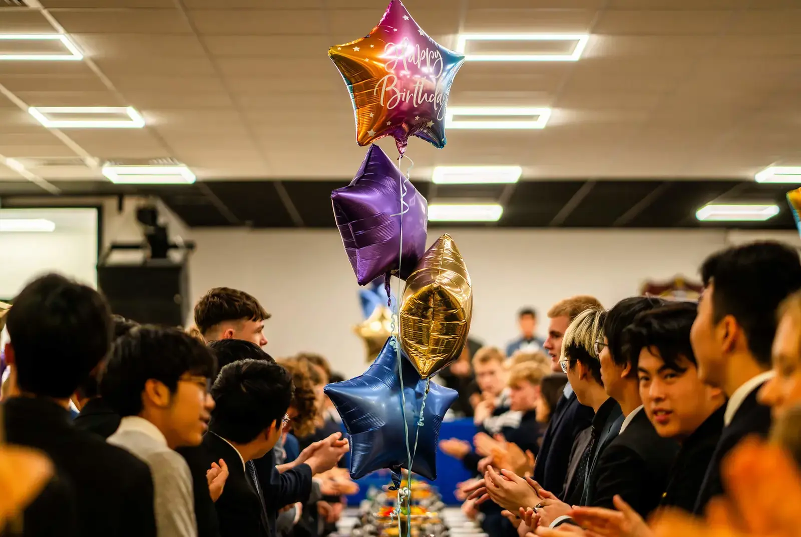 QE Faculty students at a birthday party