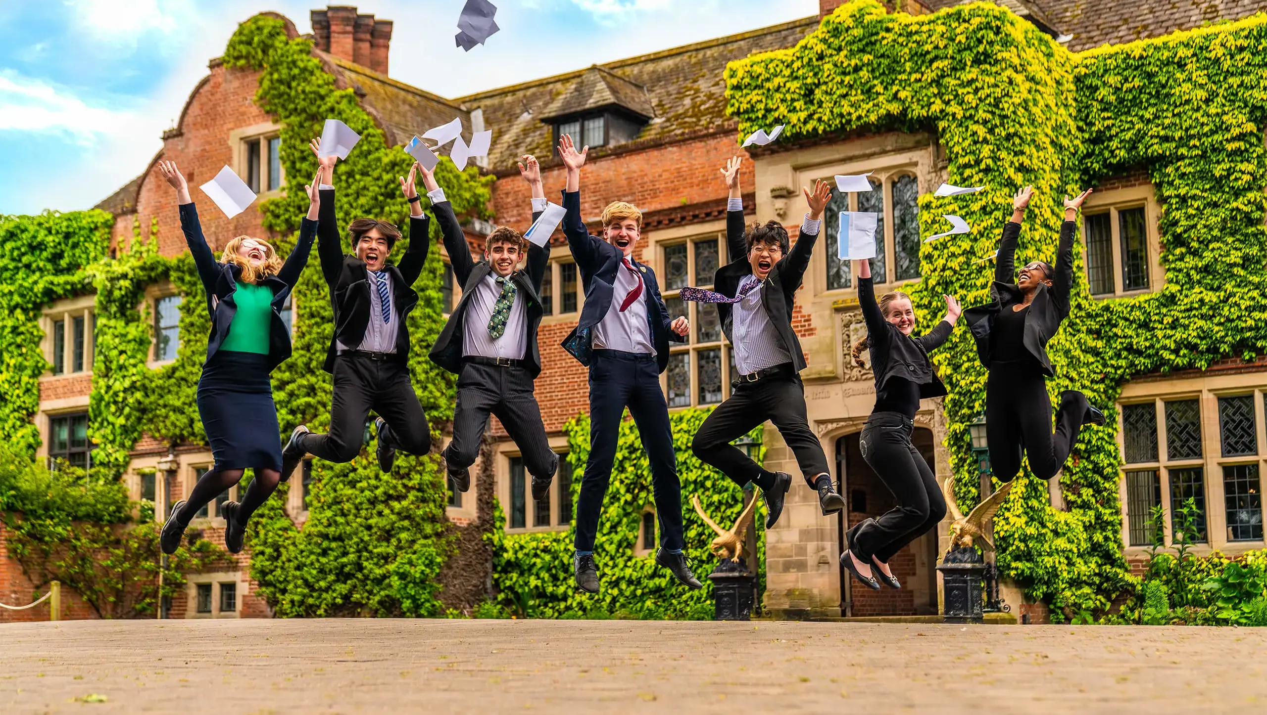 Students jumping for joy at their A Level and BTEC results.