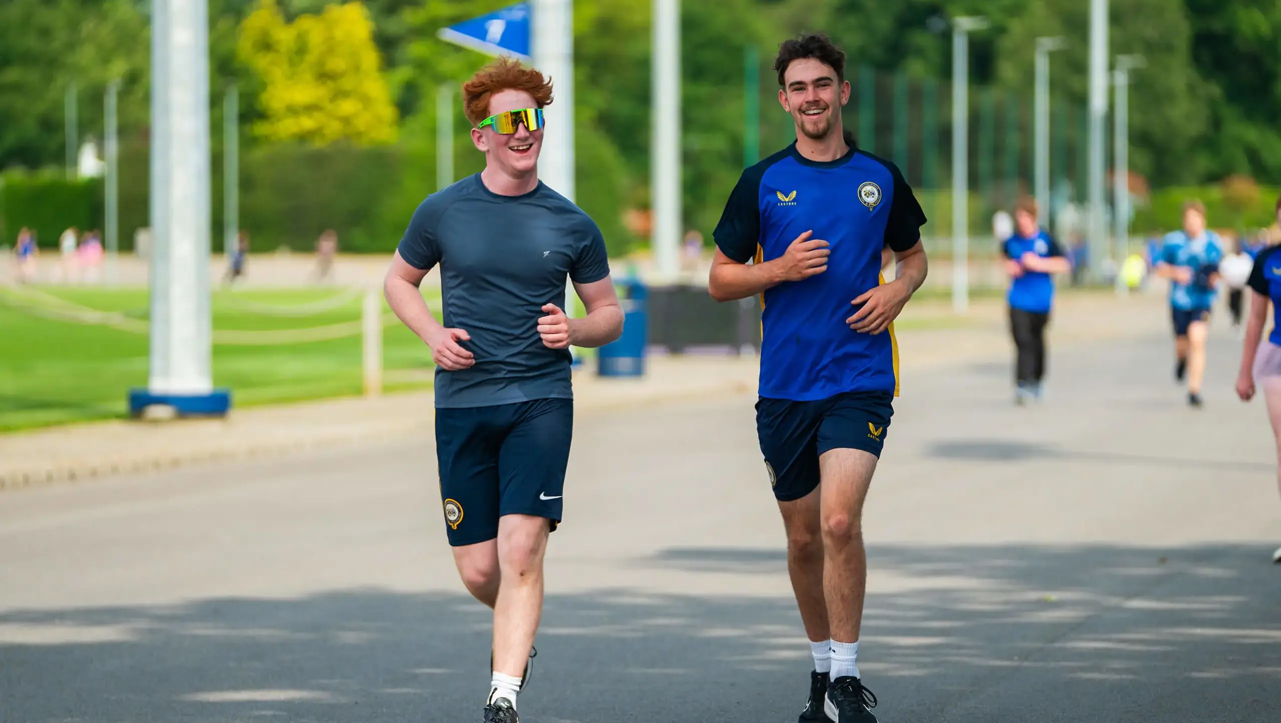 Students improving their wellbeing by running race for life.