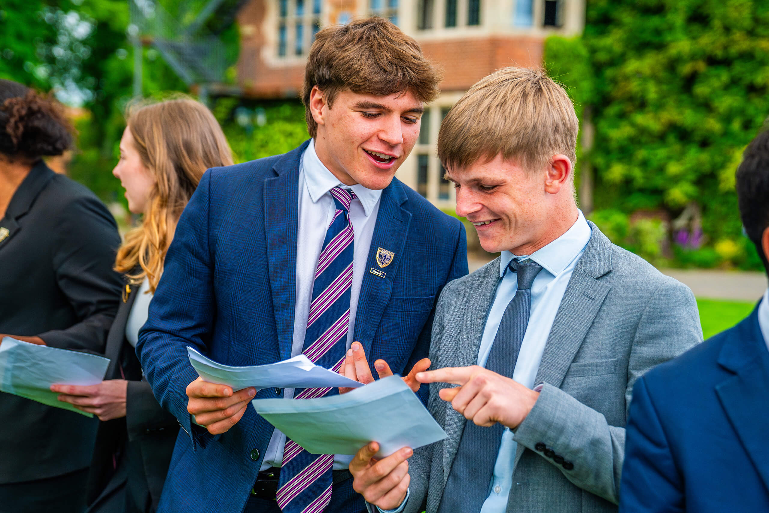 Two students from Faculty looking at their results.