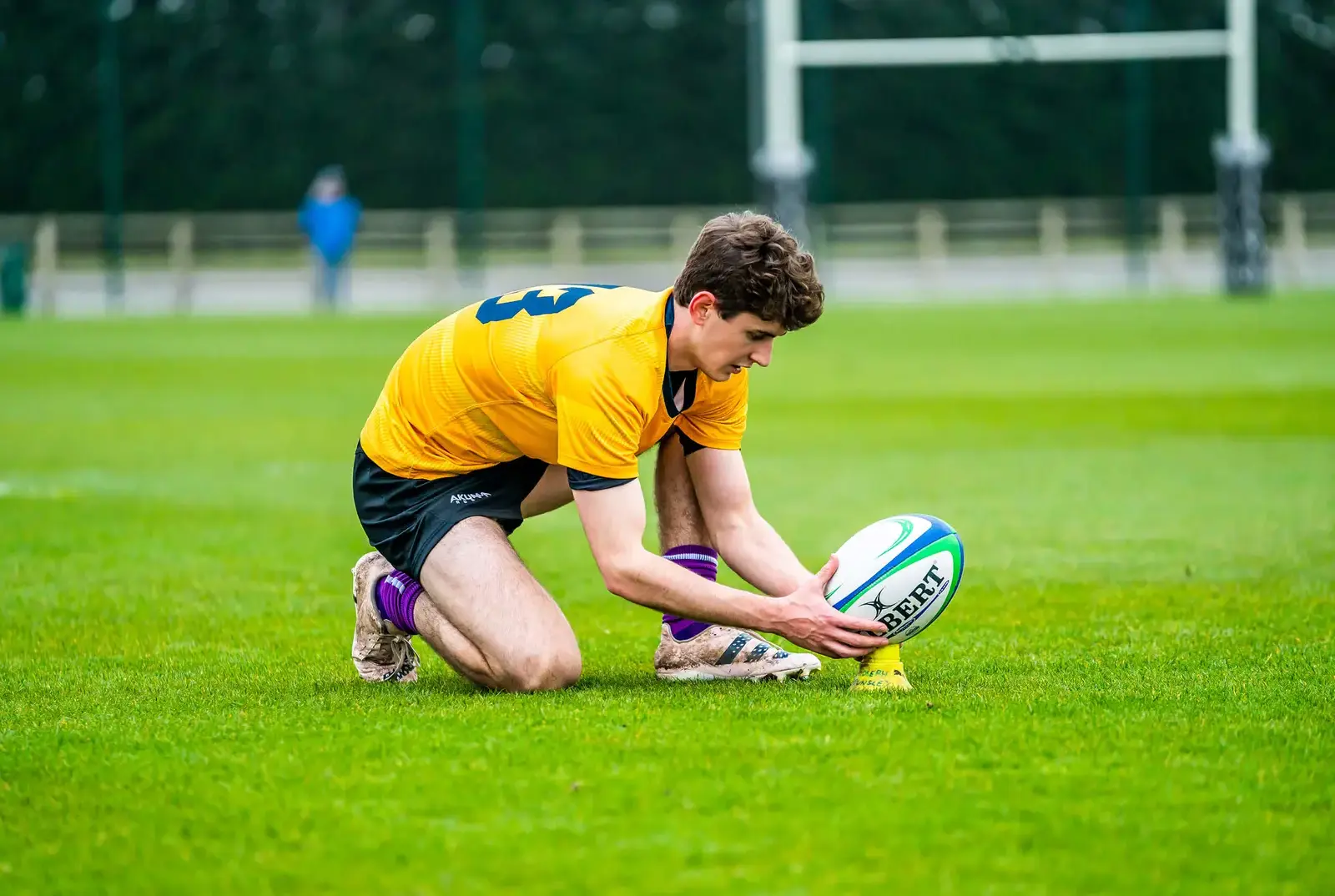 QE pupil playing rugby