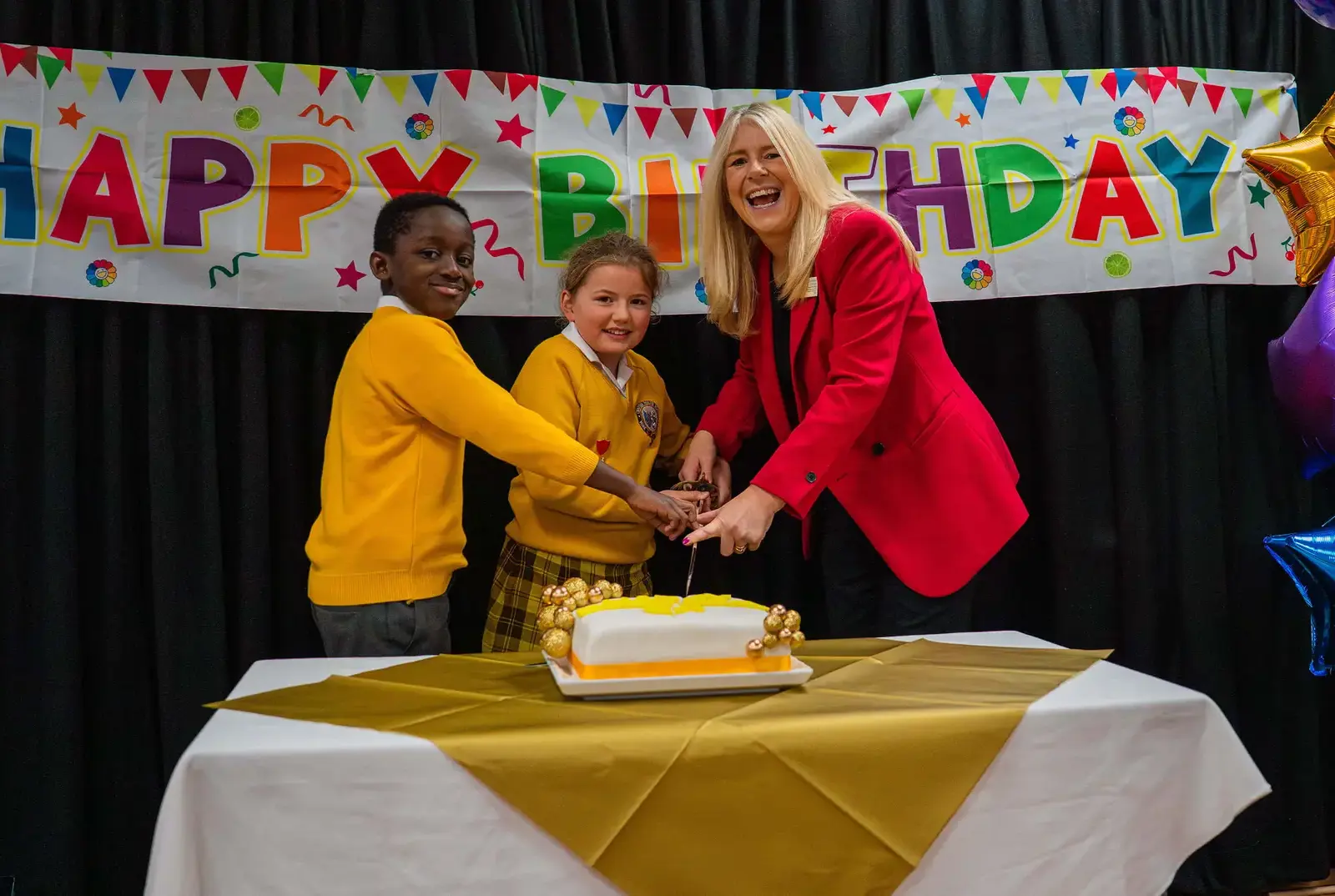 Cutting the cake at Chapter House's School Birthday.
