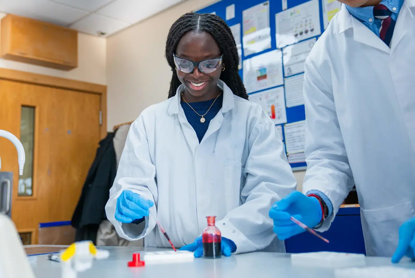 Student in a science lesson at Queen Ethelburga's College.