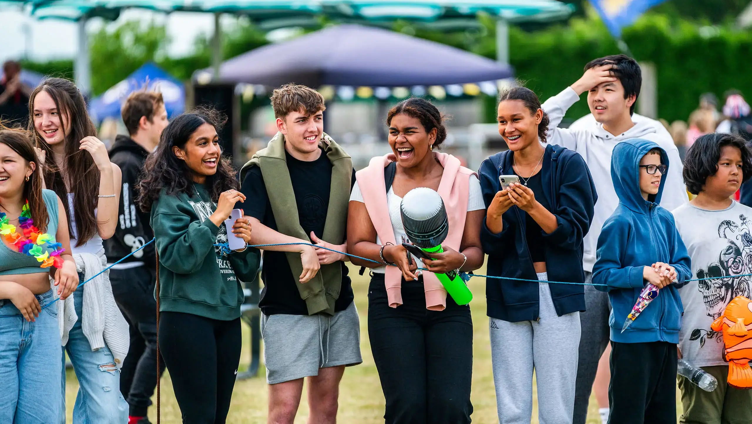 Group of friends laughing at the end of year celebration at Queen Ethelburga's.