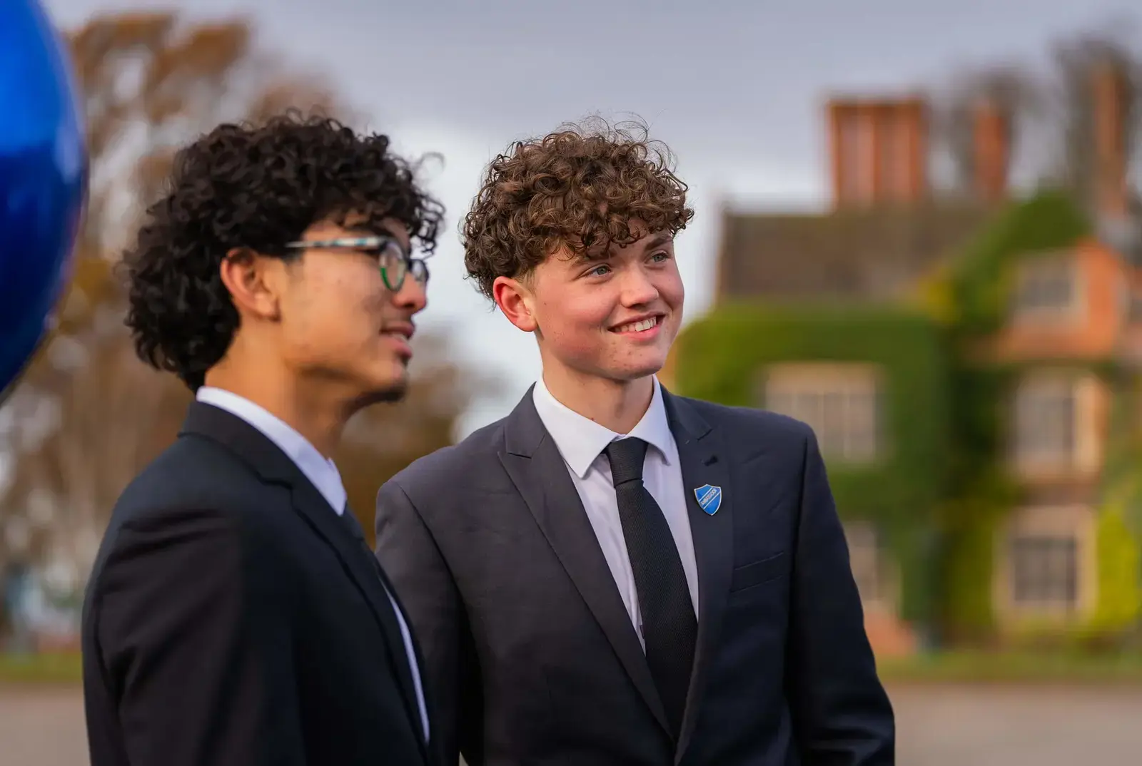 Sixth Form students laughing outside Queen Ethelburga's