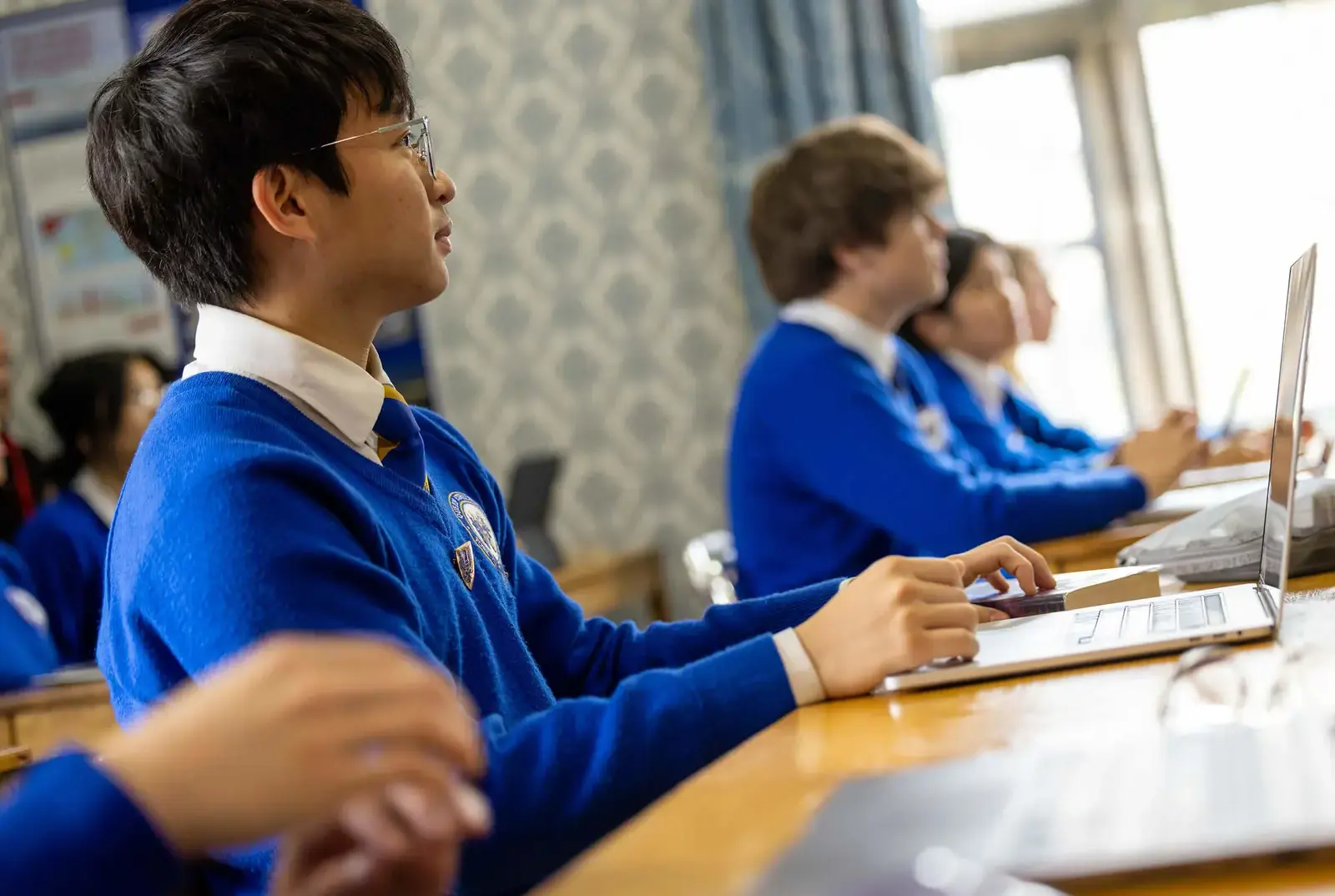 Senior school pupils working in class