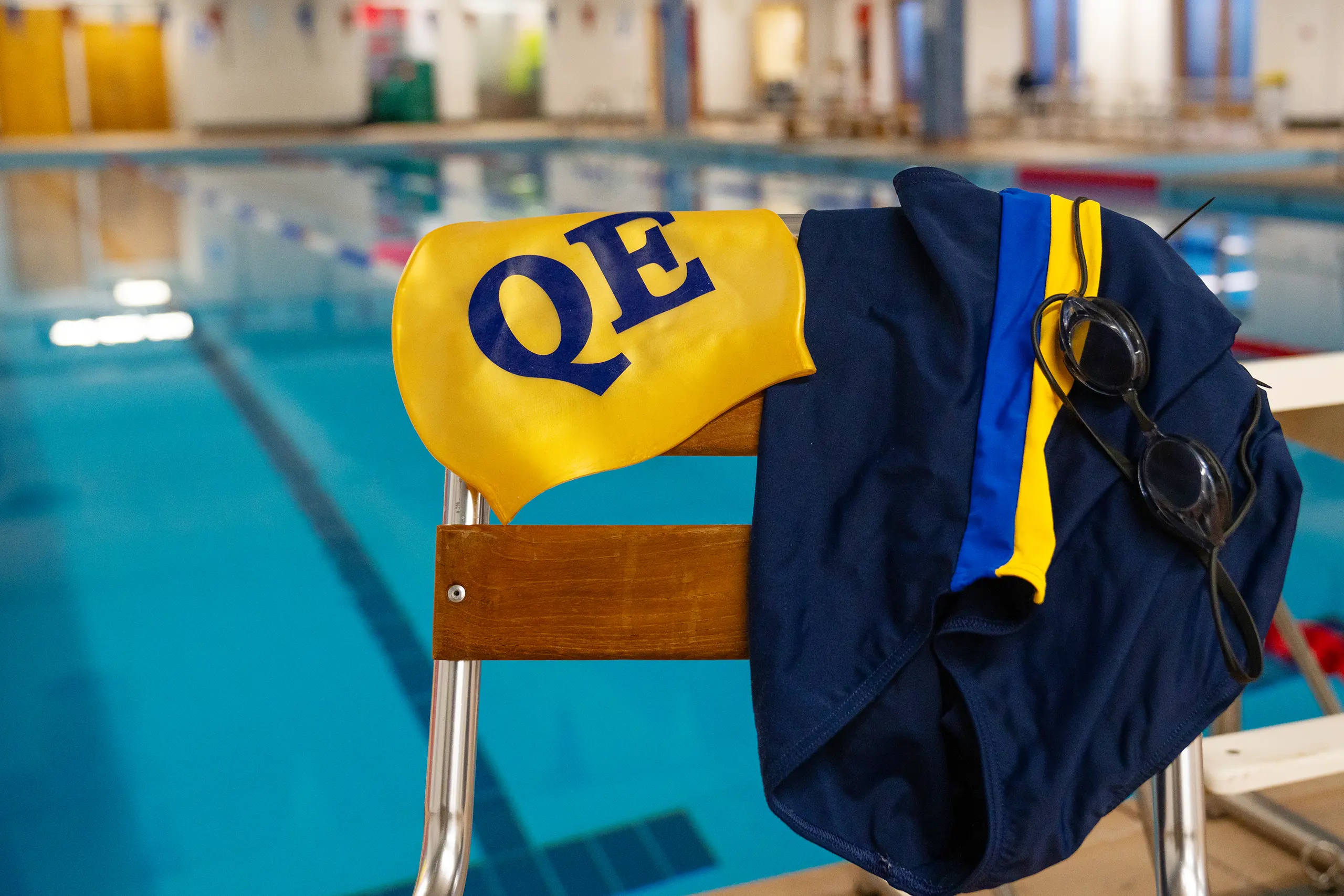 Swim cap, goggles and costume for swimming lessons at QE.